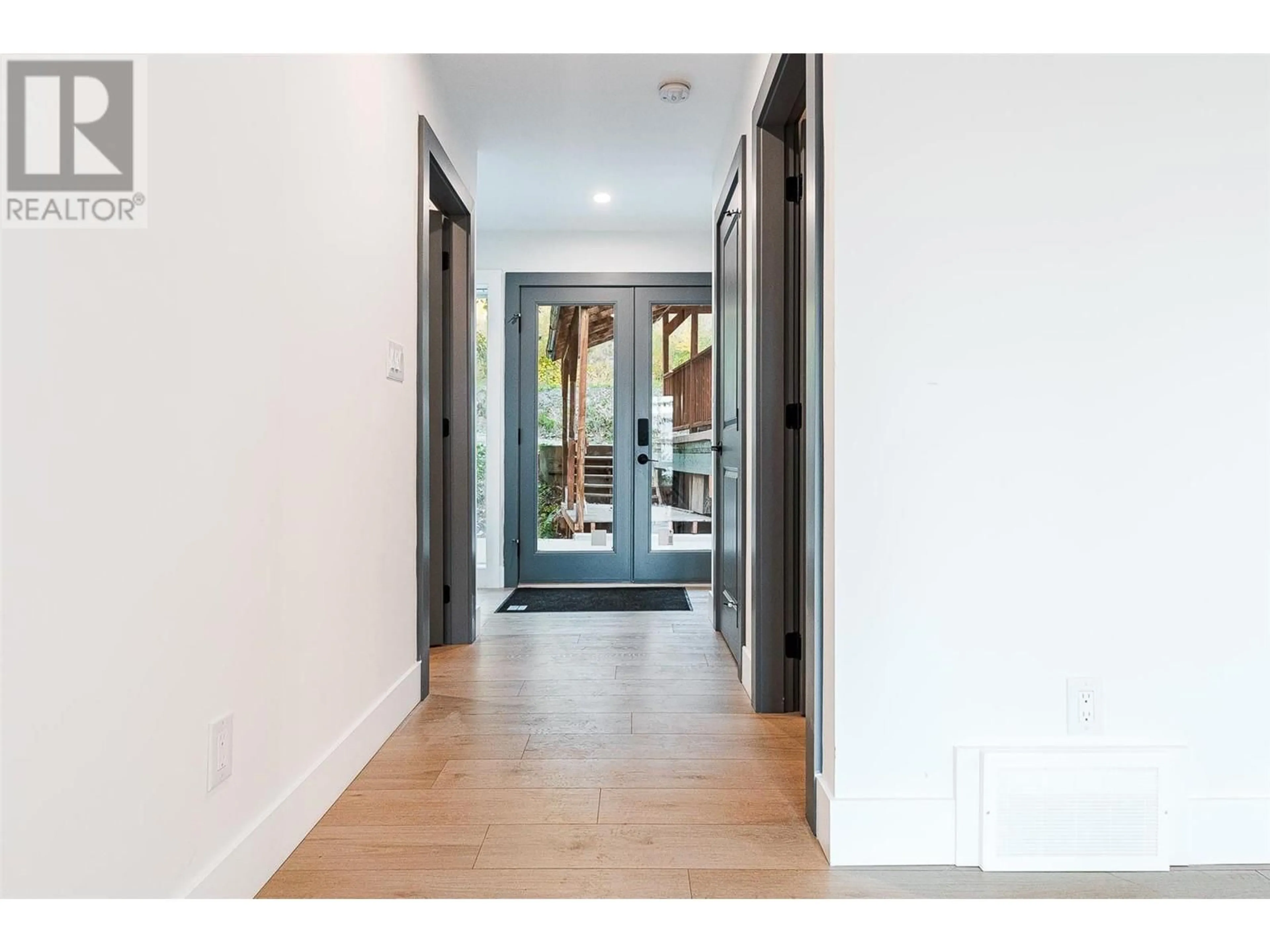 Indoor entryway, wood floors for 7418 Crowfoot Drive, Anglemont British Columbia V0E1M8