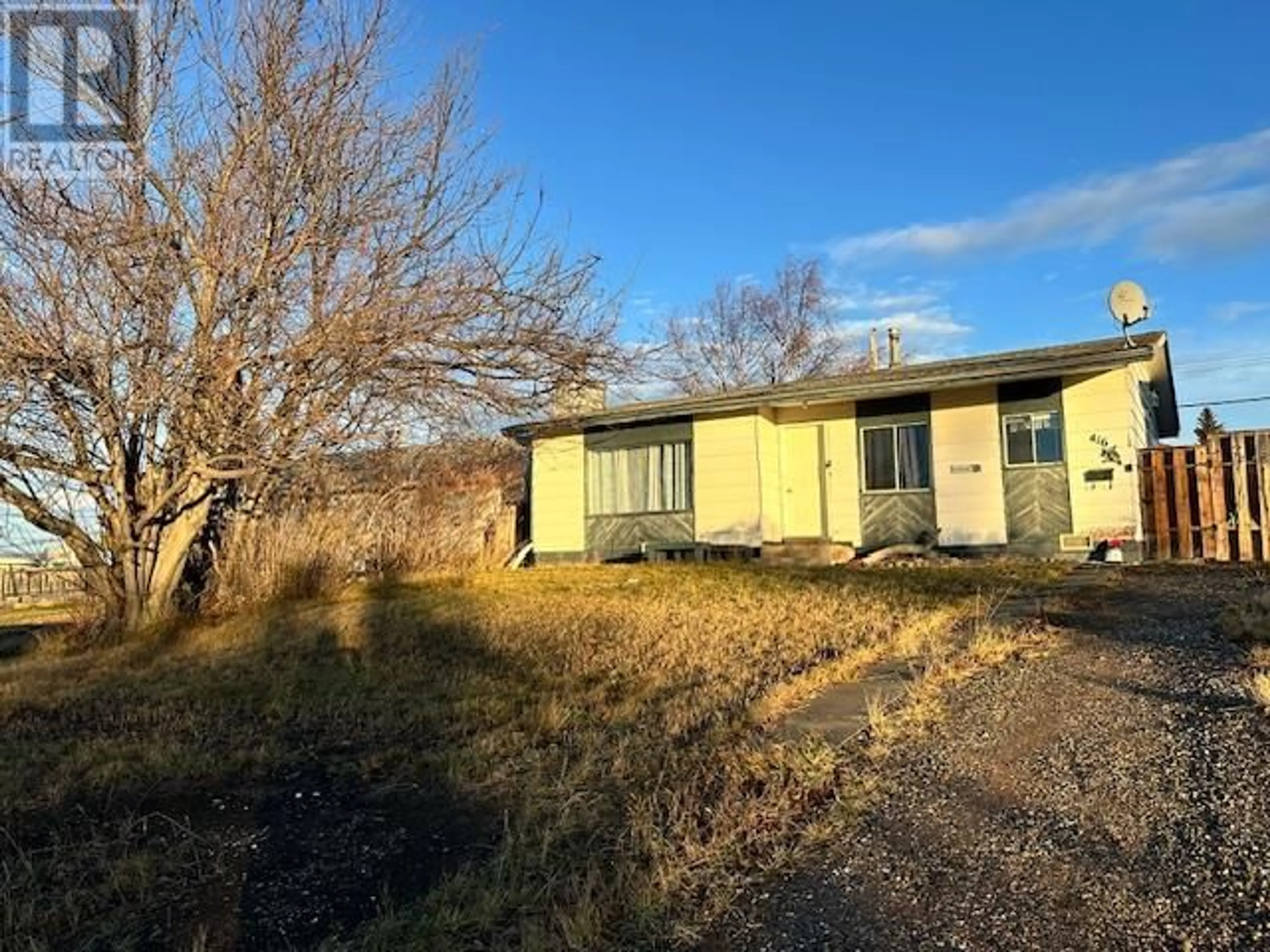 A pic from outside/outdoor area/front of a property/back of a property/a pic from drone, building for 416 100A AVENUE, Dawson Creek British Columbia V1G1X6
