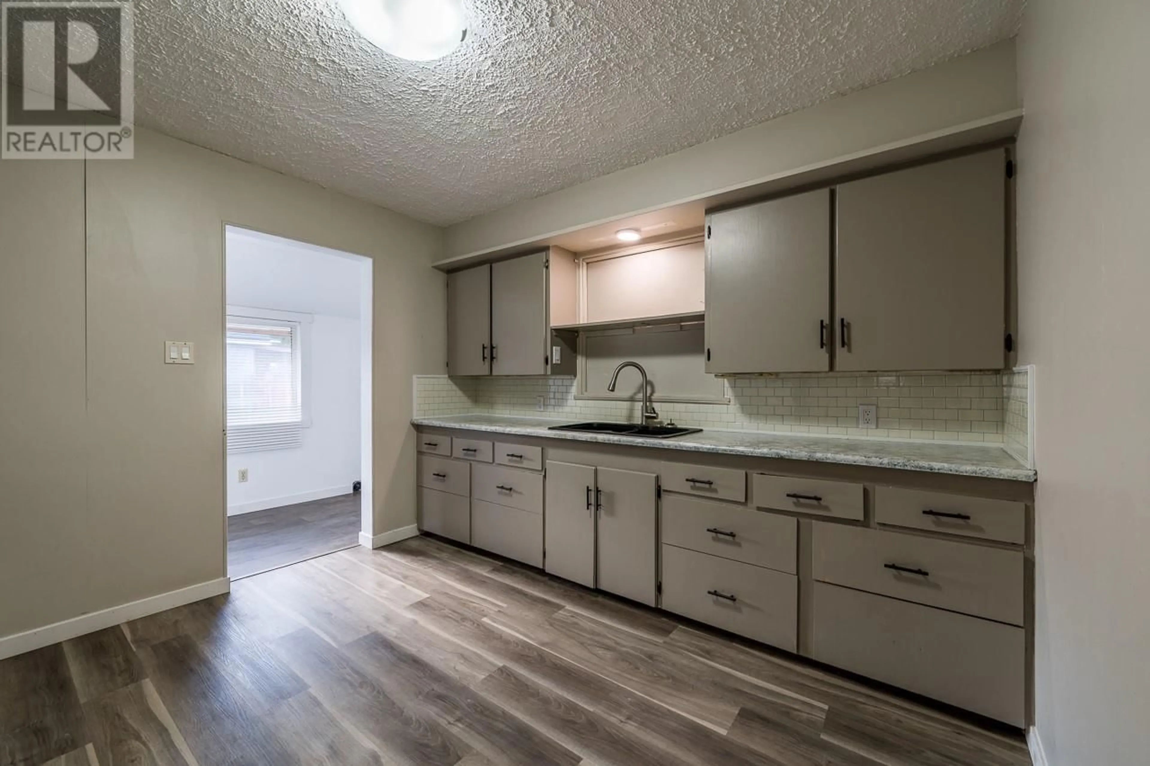 Standard kitchen, wood floors, cottage for 4085 Yellowhead Highway, Kamloops British Columbia V2H1K7