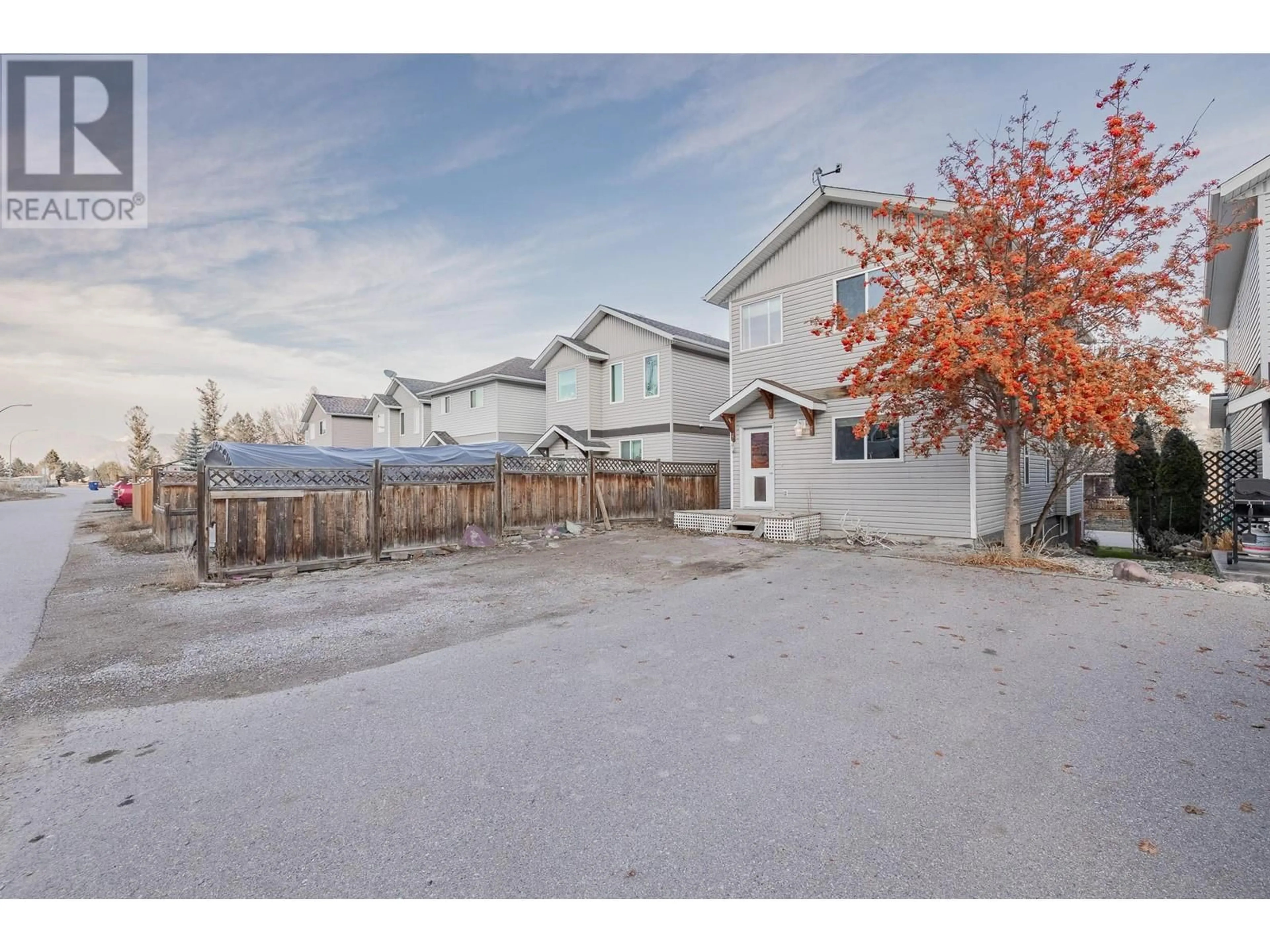 A pic from exterior of the house or condo, the fenced backyard for 2208 Westside Park Avenue, Invermere British Columbia V0A1K4