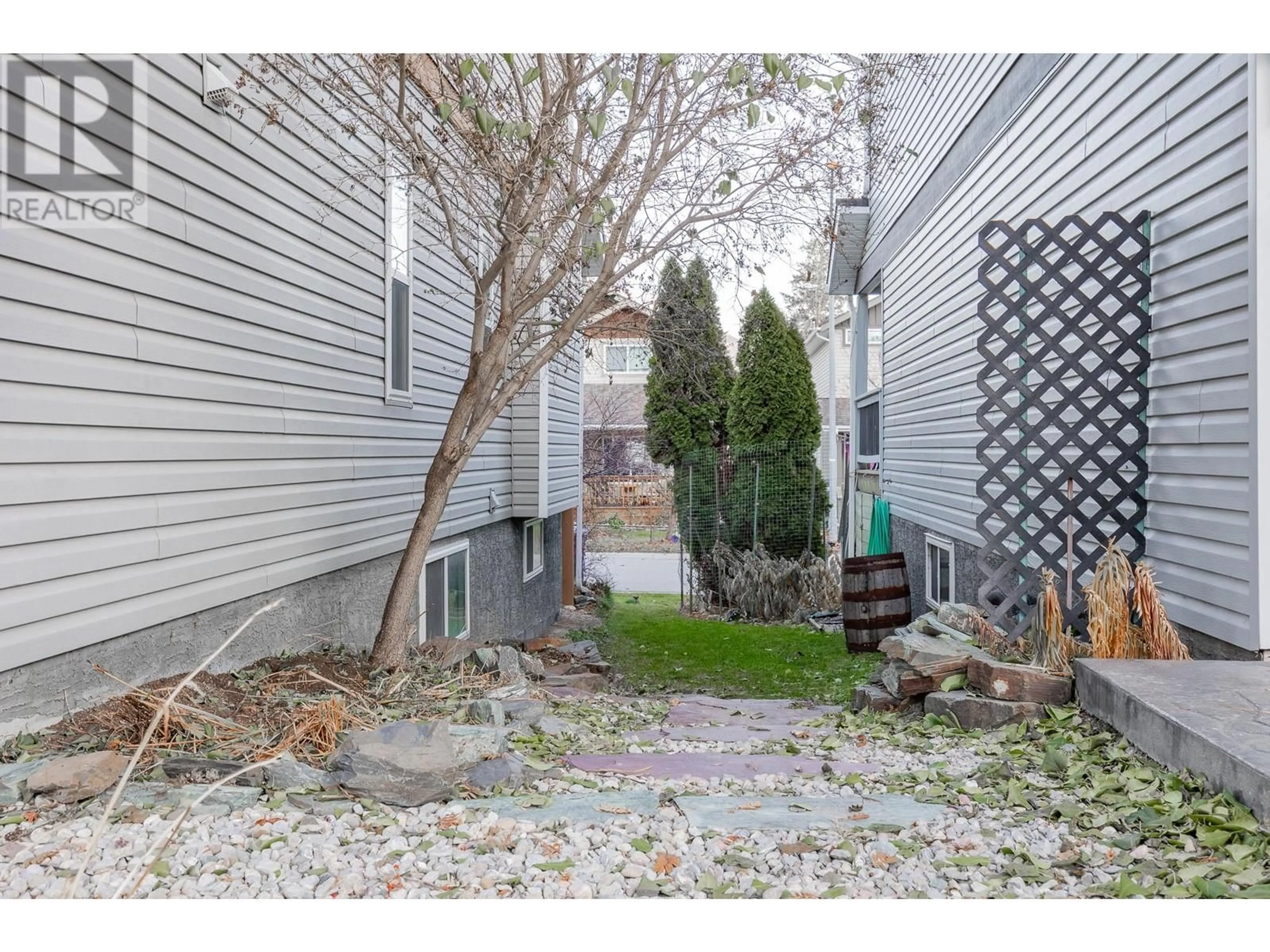 A pic from exterior of the house or condo, the fenced backyard for 2208 Westside Park Avenue, Invermere British Columbia V0A1K4