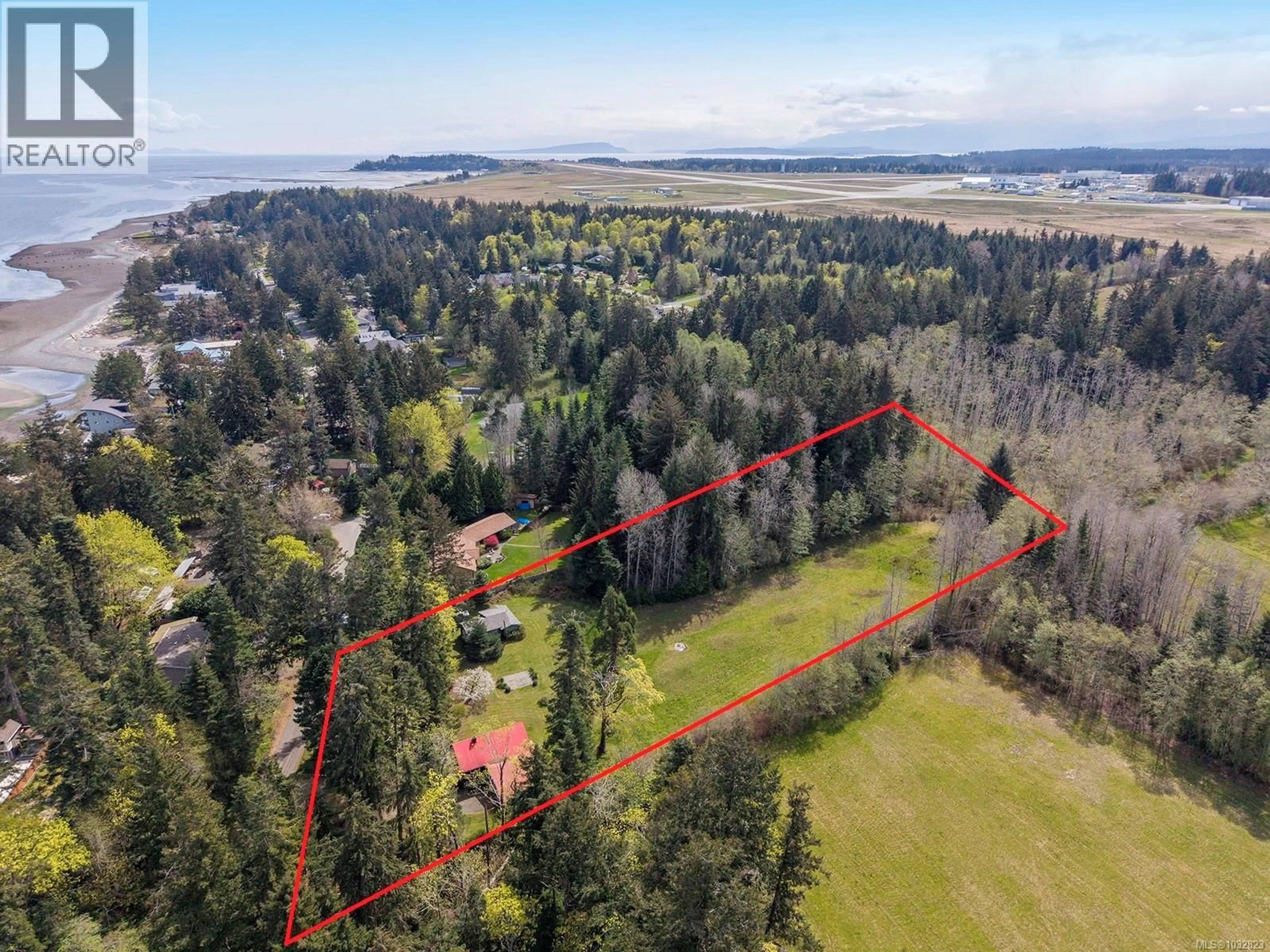 A pic from outside/outdoor area/front of a property/back of a property/a pic from drone, forest/trees view for 1821 BUTLER ROAD, Comox British Columbia V9M4B4