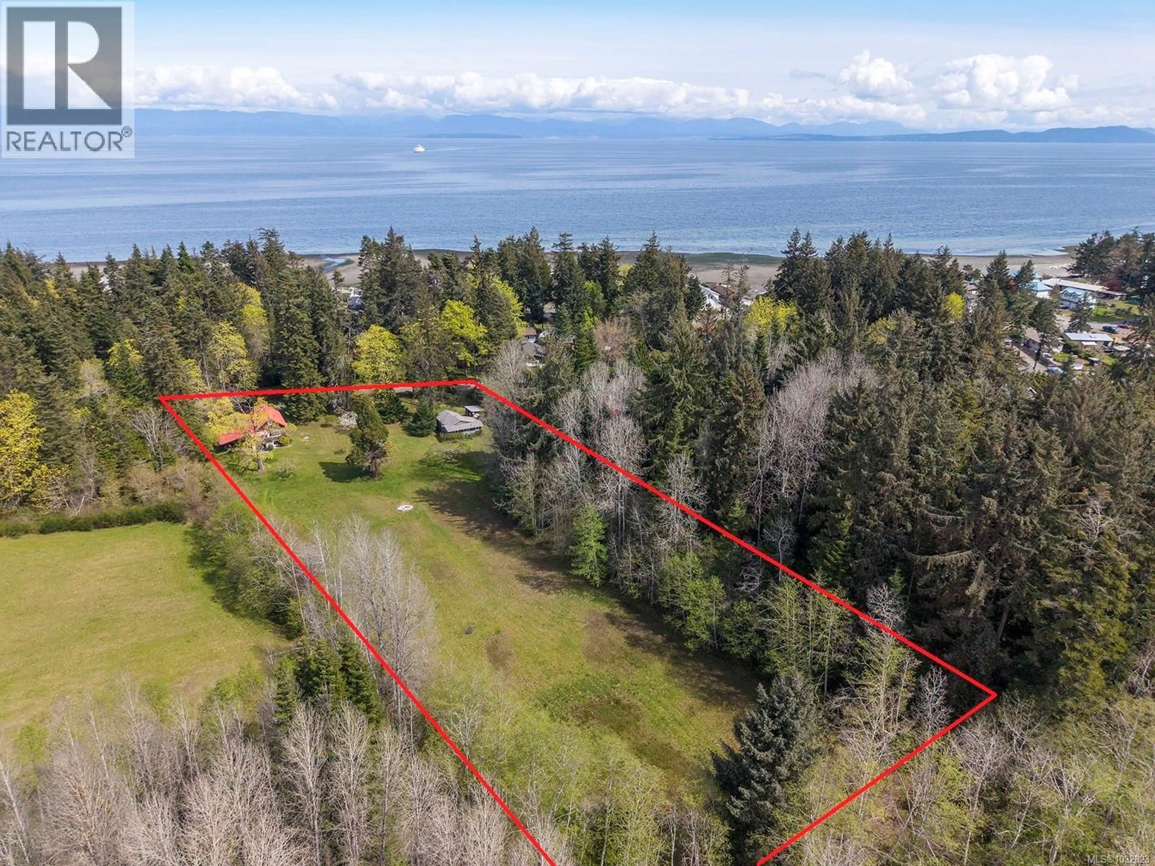 A pic from outside/outdoor area/front of a property/back of a property/a pic from drone, water/lake/river/ocean view for 1821 BUTLER ROAD, Comox British Columbia V9M4B4