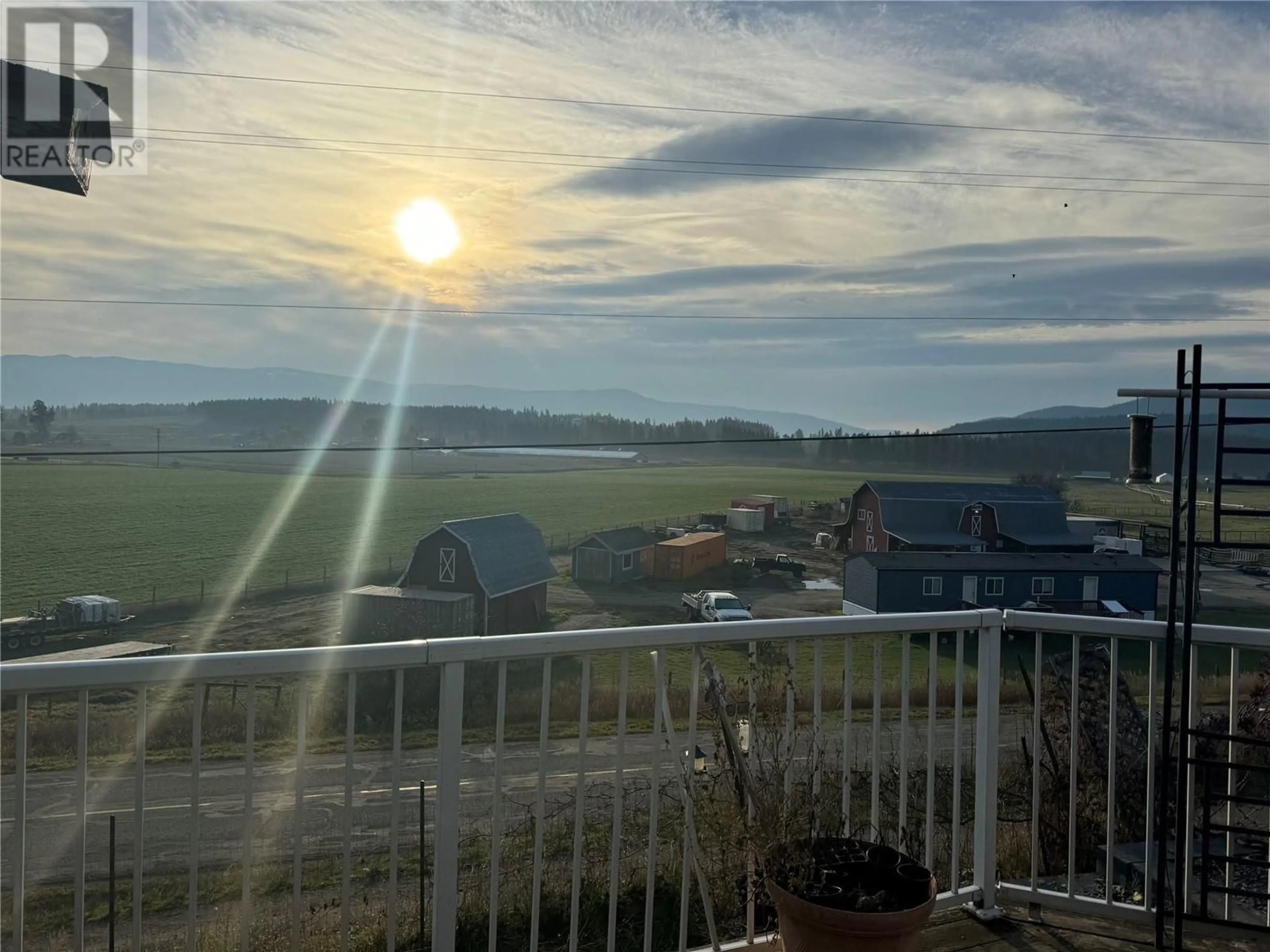 A pic from exterior of the house or condo, the fenced backyard for 4382 Hullcar Road, Armstrong British Columbia V0E1B4