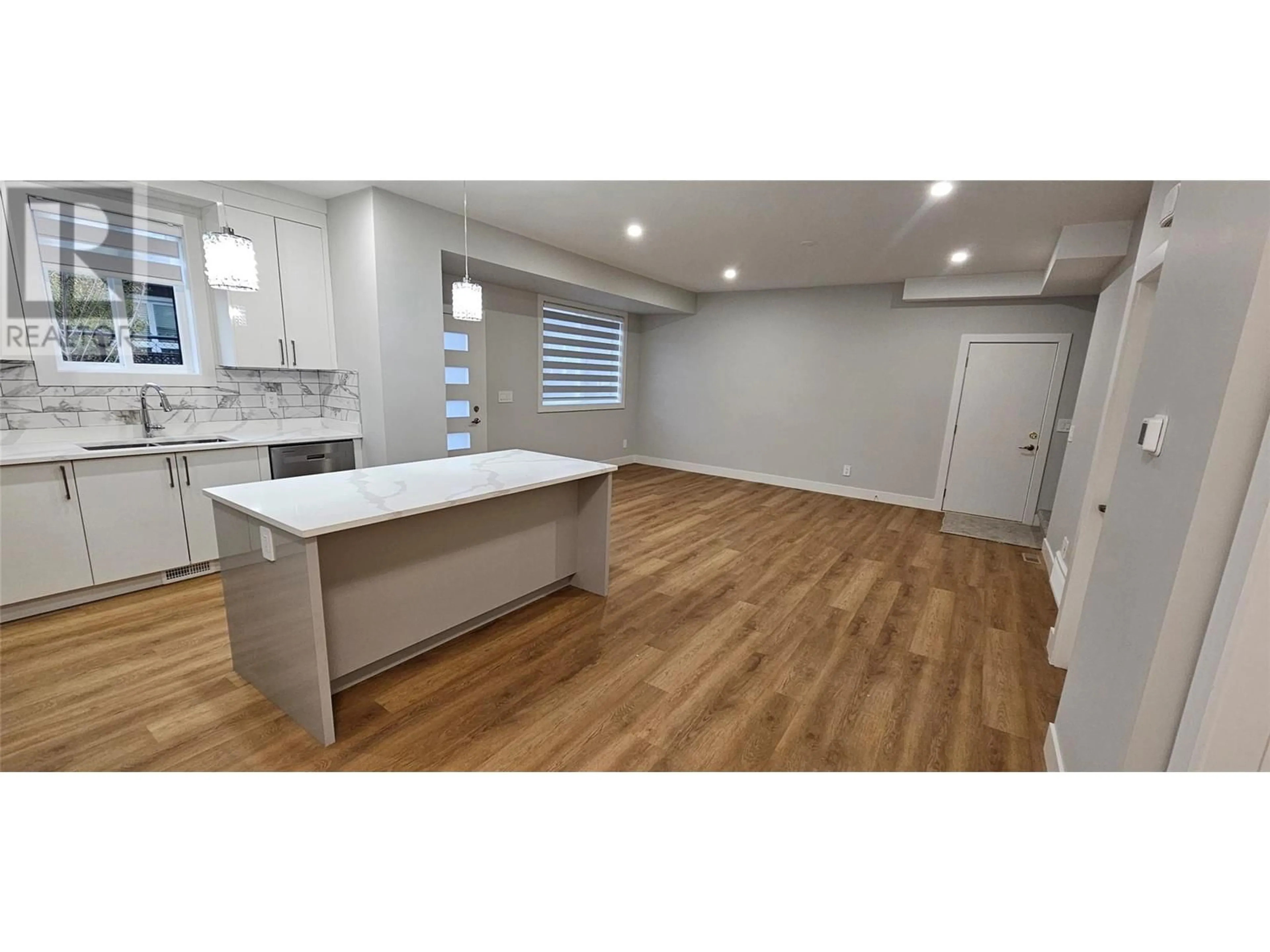 Open concept kitchen, wood/laminate floor for 105 - 125 CALGARY AVENUE, Penticton British Columbia V2A2T7