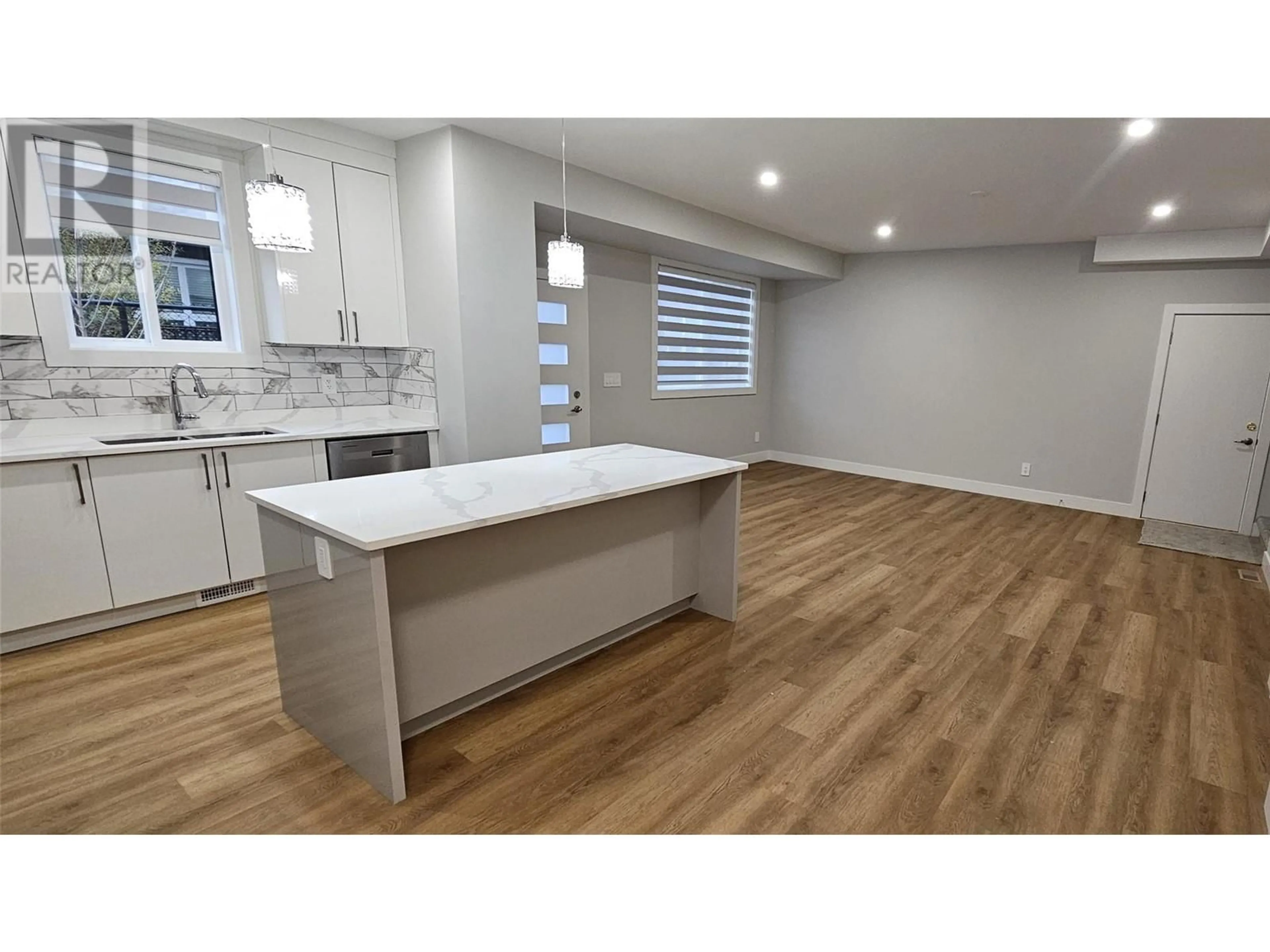 Open concept kitchen, wood/laminate floor for 105 - 125 CALGARY AVENUE, Penticton British Columbia V2A2T7
