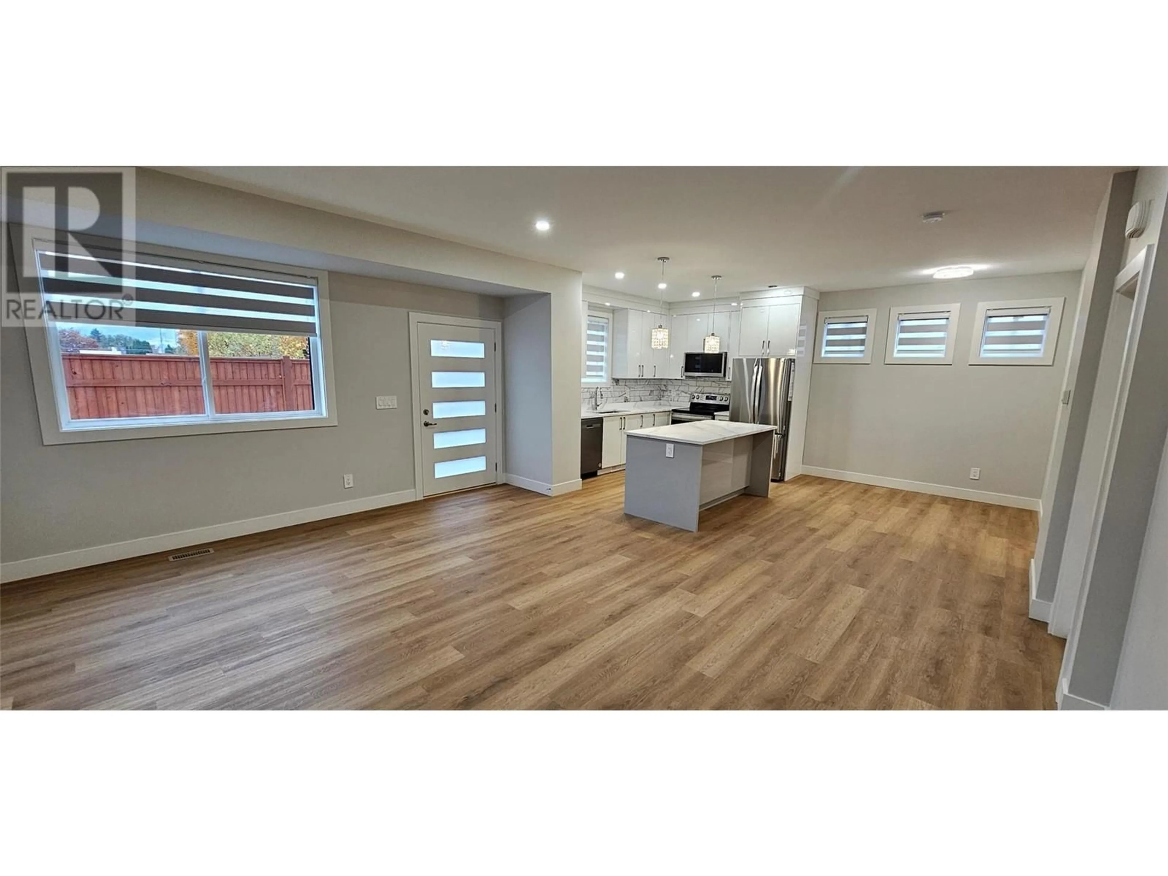 Open concept kitchen, wood/laminate floor for 106 - 125 CALGARY AVENUE, Penticton British Columbia V2A2T7