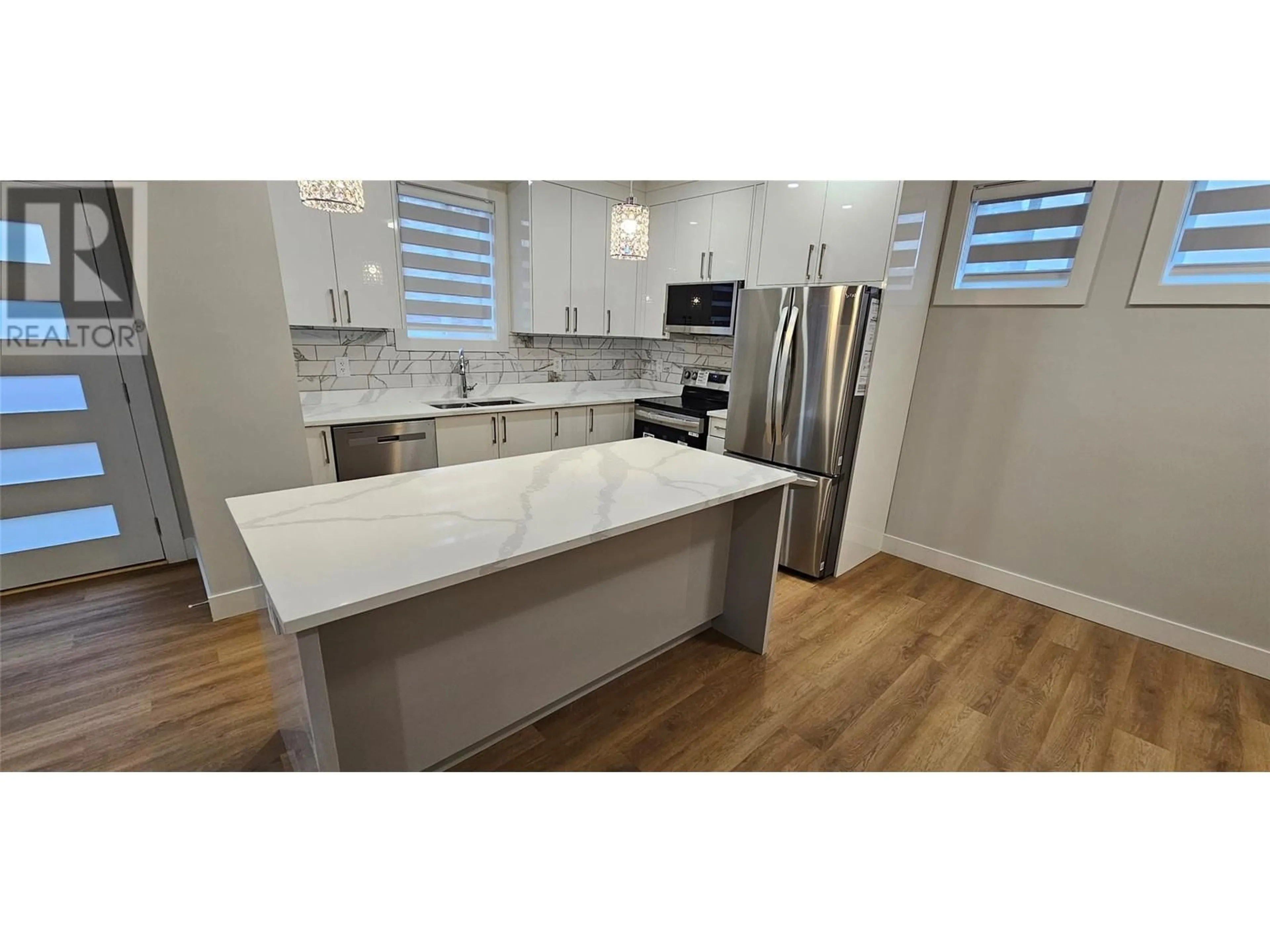 Contemporary kitchen, wood floors for 125 Calgary Avenue Unit# 106, Penticton British Columbia V2A2T7