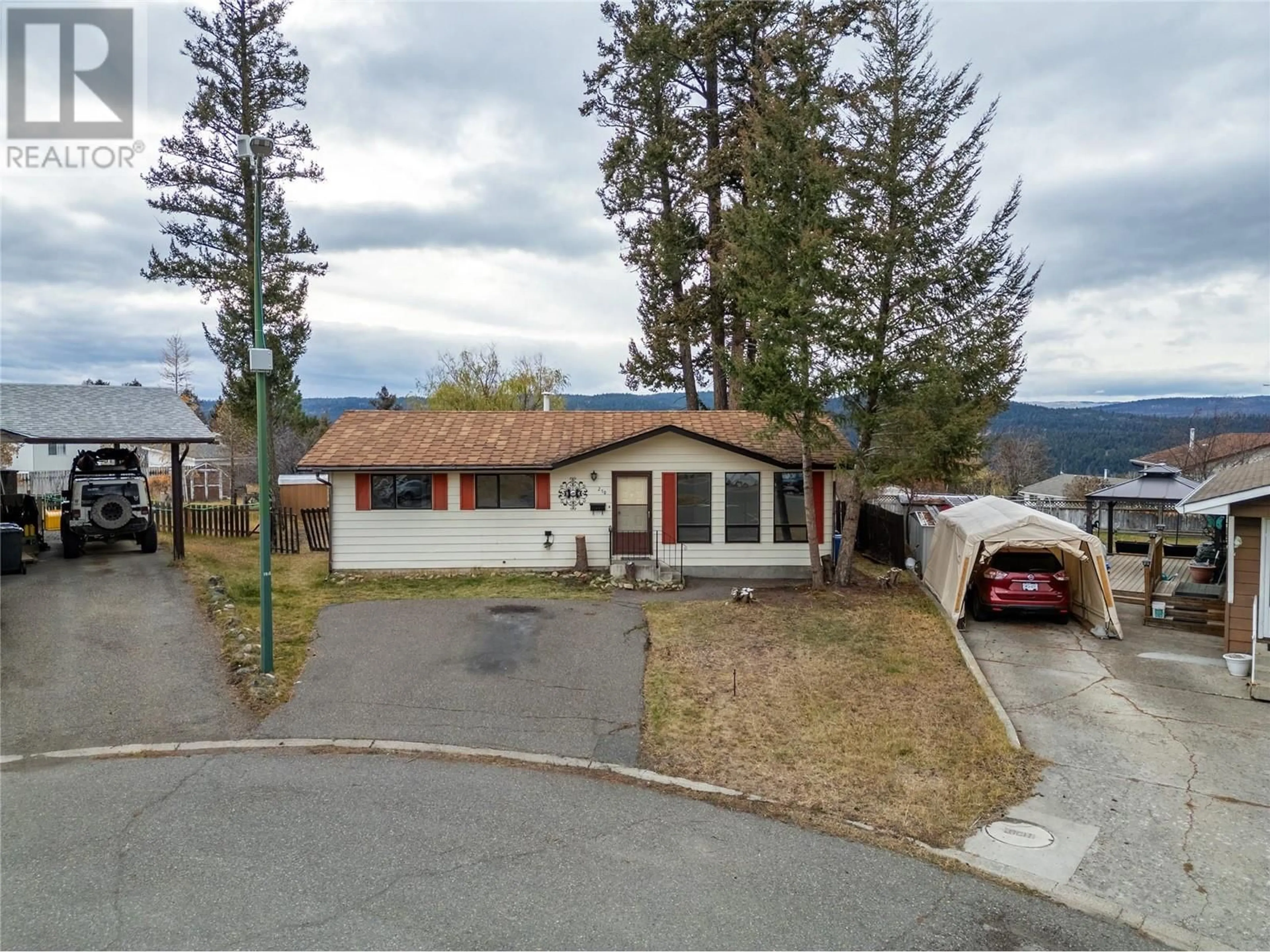 Frontside or backside of a home, the street view for 210 Basalt Place, Logan Lake British Columbia V0K1W0