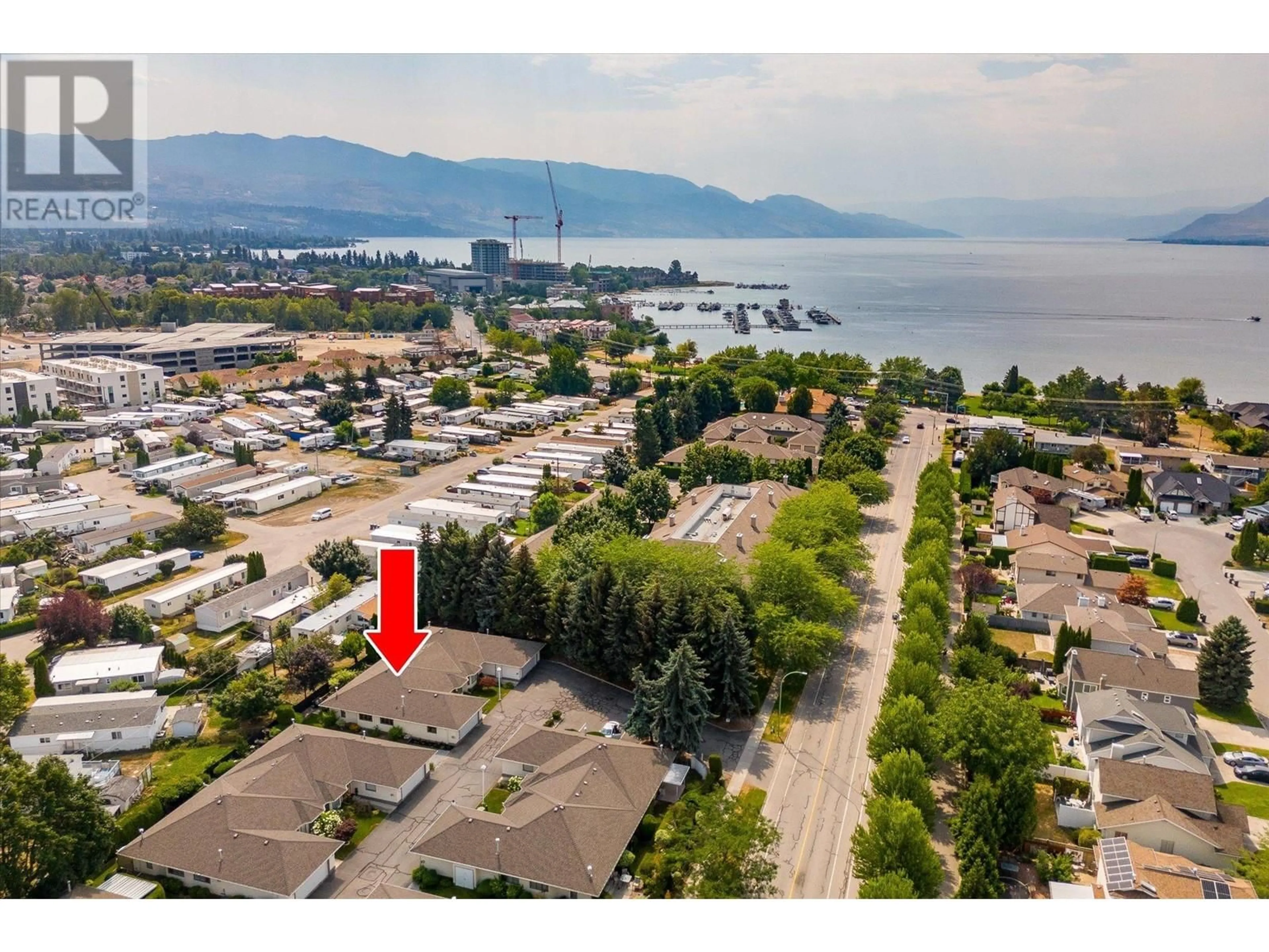 A pic from exterior of the house or condo, the street view for 715 Barrera Road Unit# 8, Kelowna British Columbia V1W3C9