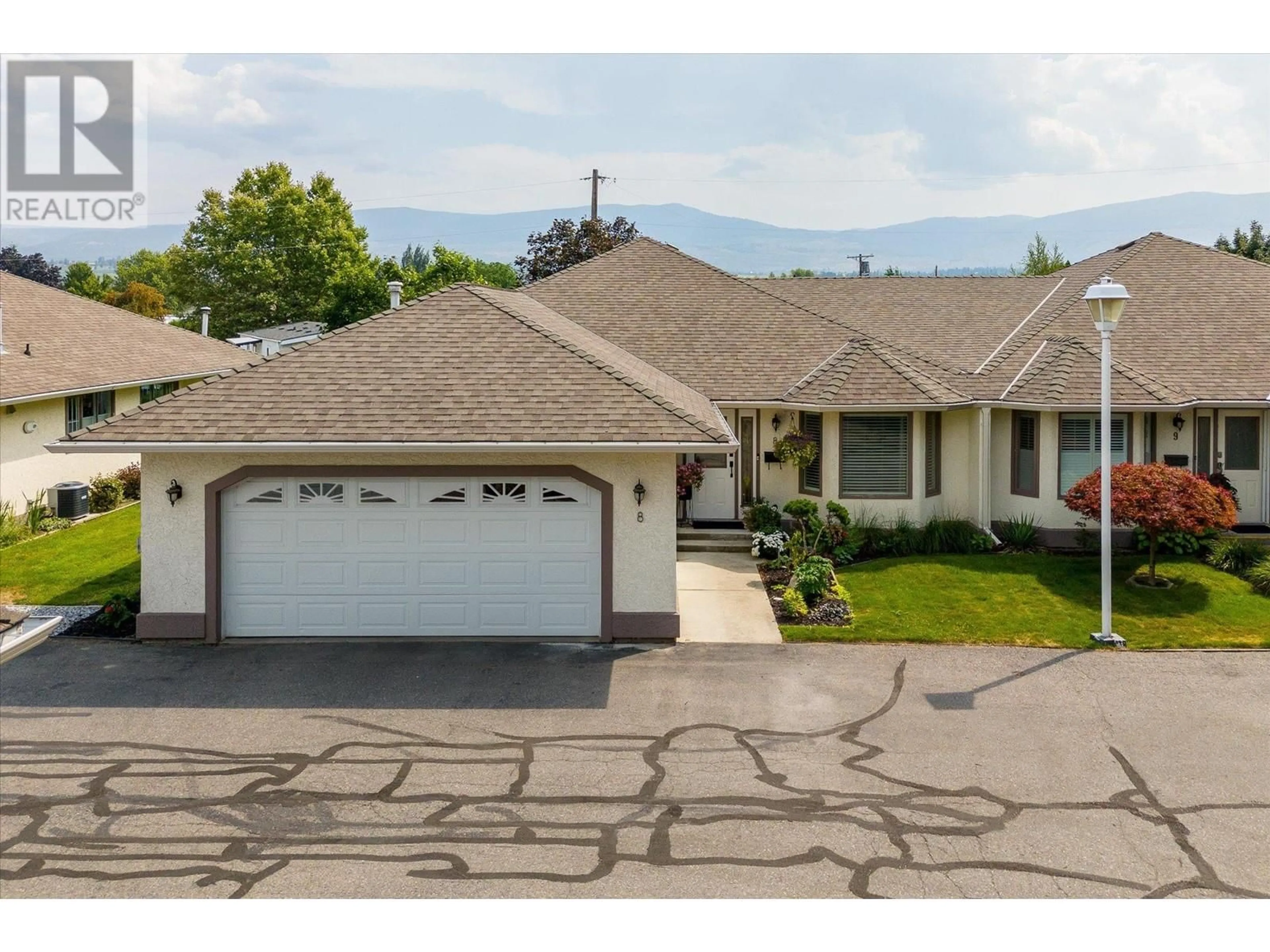 A pic from exterior of the house or condo, the street view for 715 Barrera Road Unit# 8, Kelowna British Columbia V1W3C9