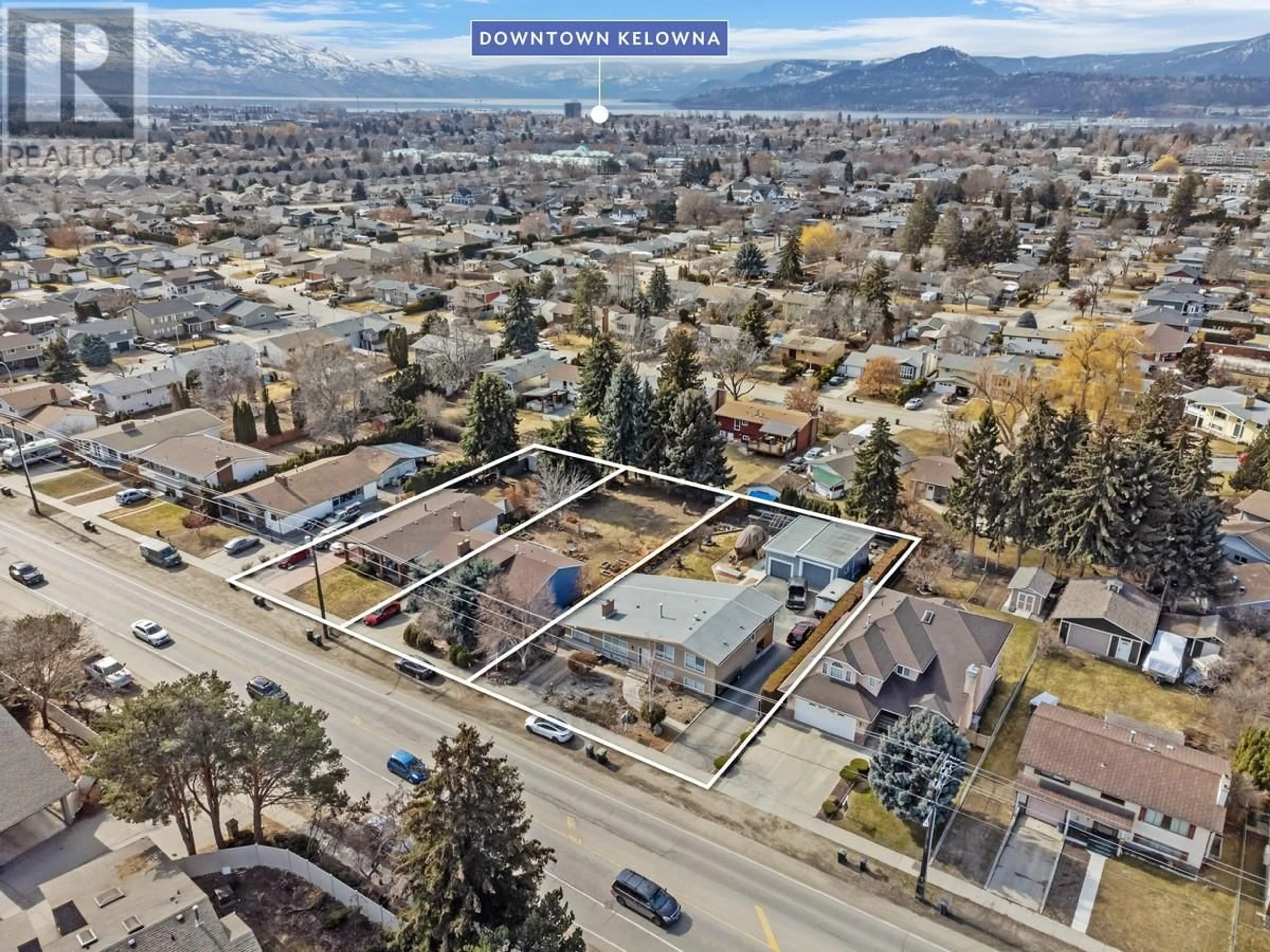 A pic from outside/outdoor area/front of a property/back of a property/a pic from drone, mountain view for 2150 BURTCH ROAD, Kelowna British Columbia V1Y4B5