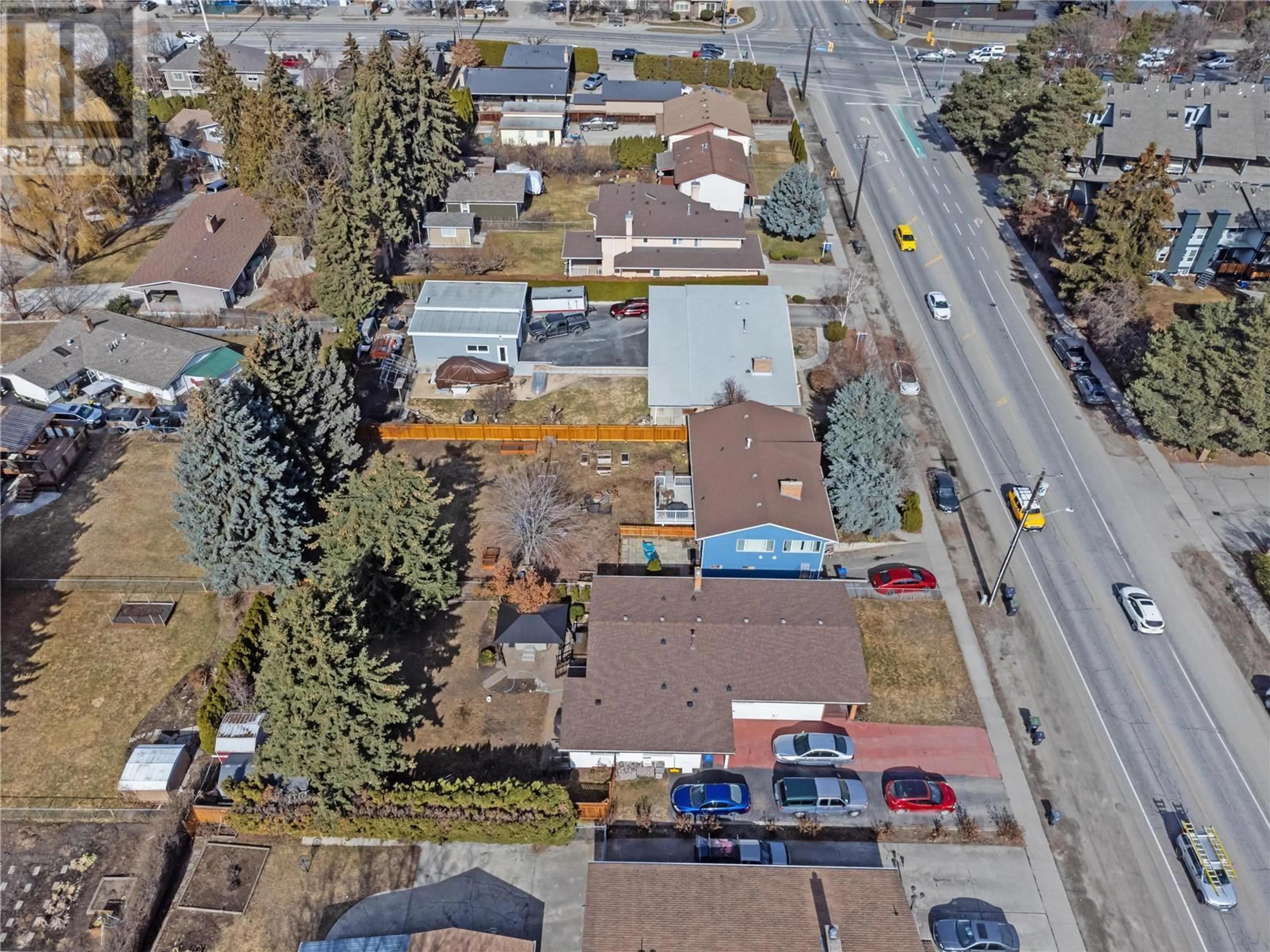 A pic from outside/outdoor area/front of a property/back of a property/a pic from drone, street for 2150 BURTCH ROAD, Kelowna British Columbia V1Y4B5