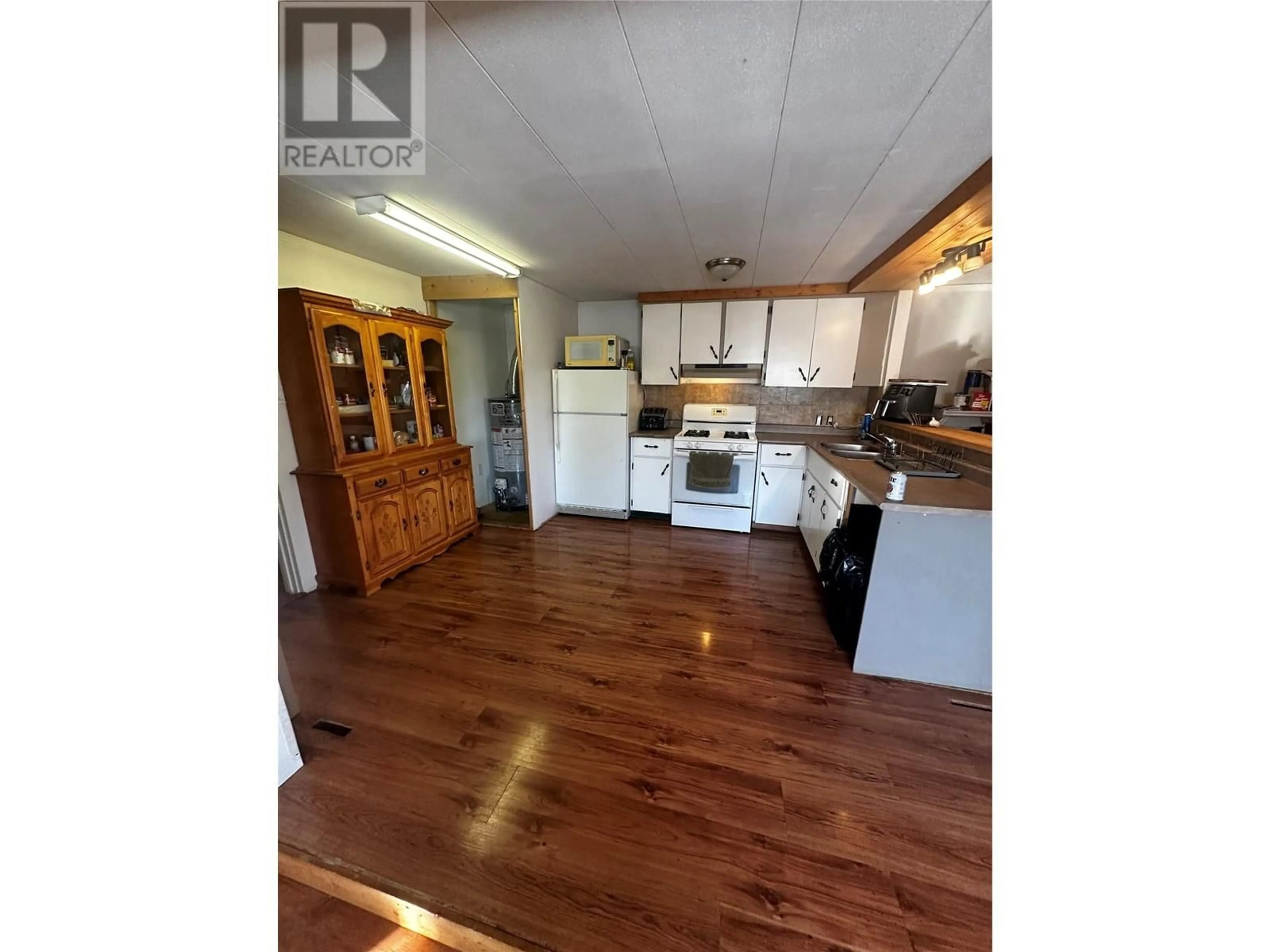 Kitchen, wood floors, cottage for 94 McClarty Sub, Chetwynd British Columbia V0C1J0