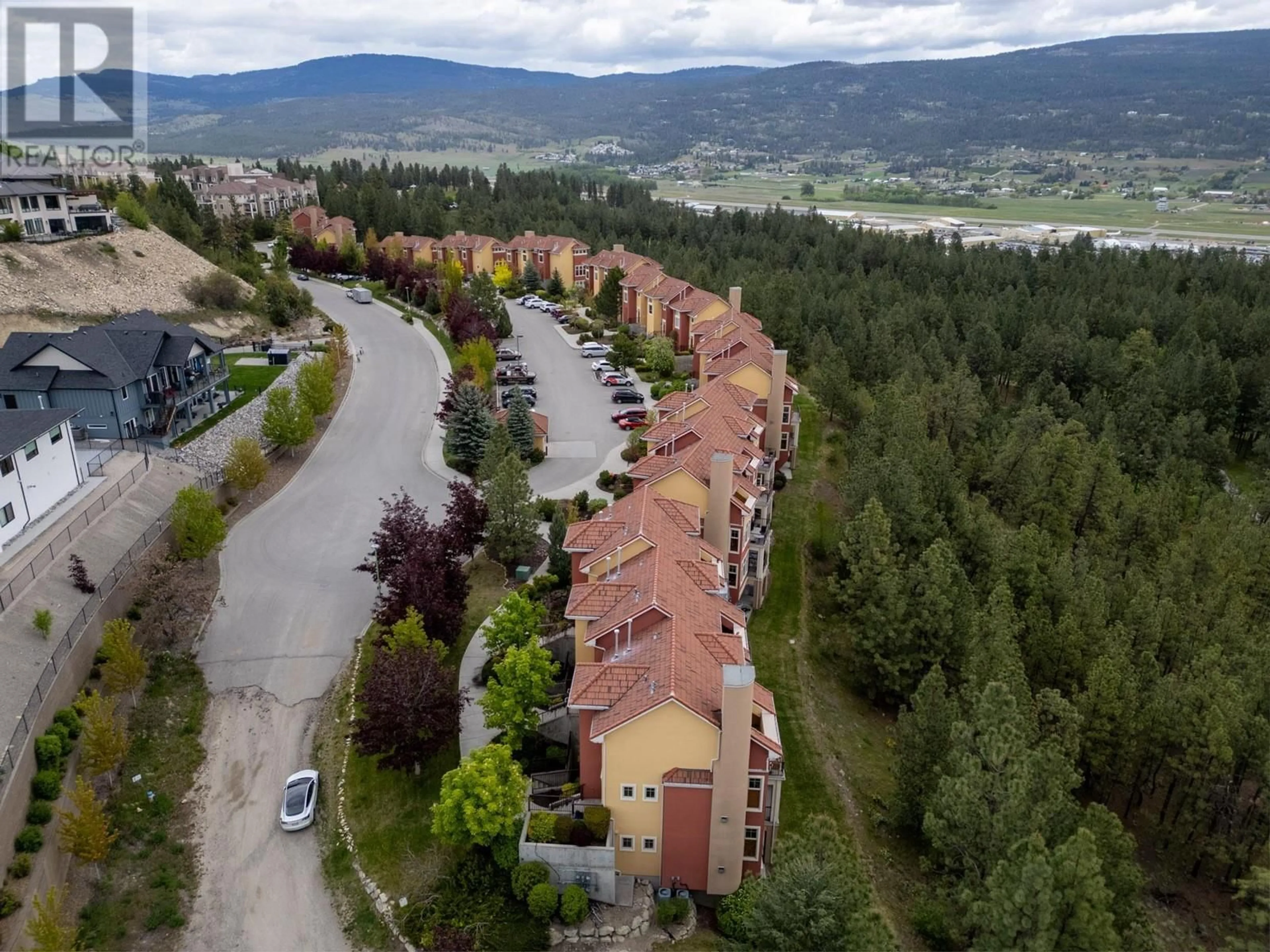 A pic from exterior of the house or condo, the street view for 1795 Country Club Drive Unit# 102, Kelowna British Columbia V1V2V9