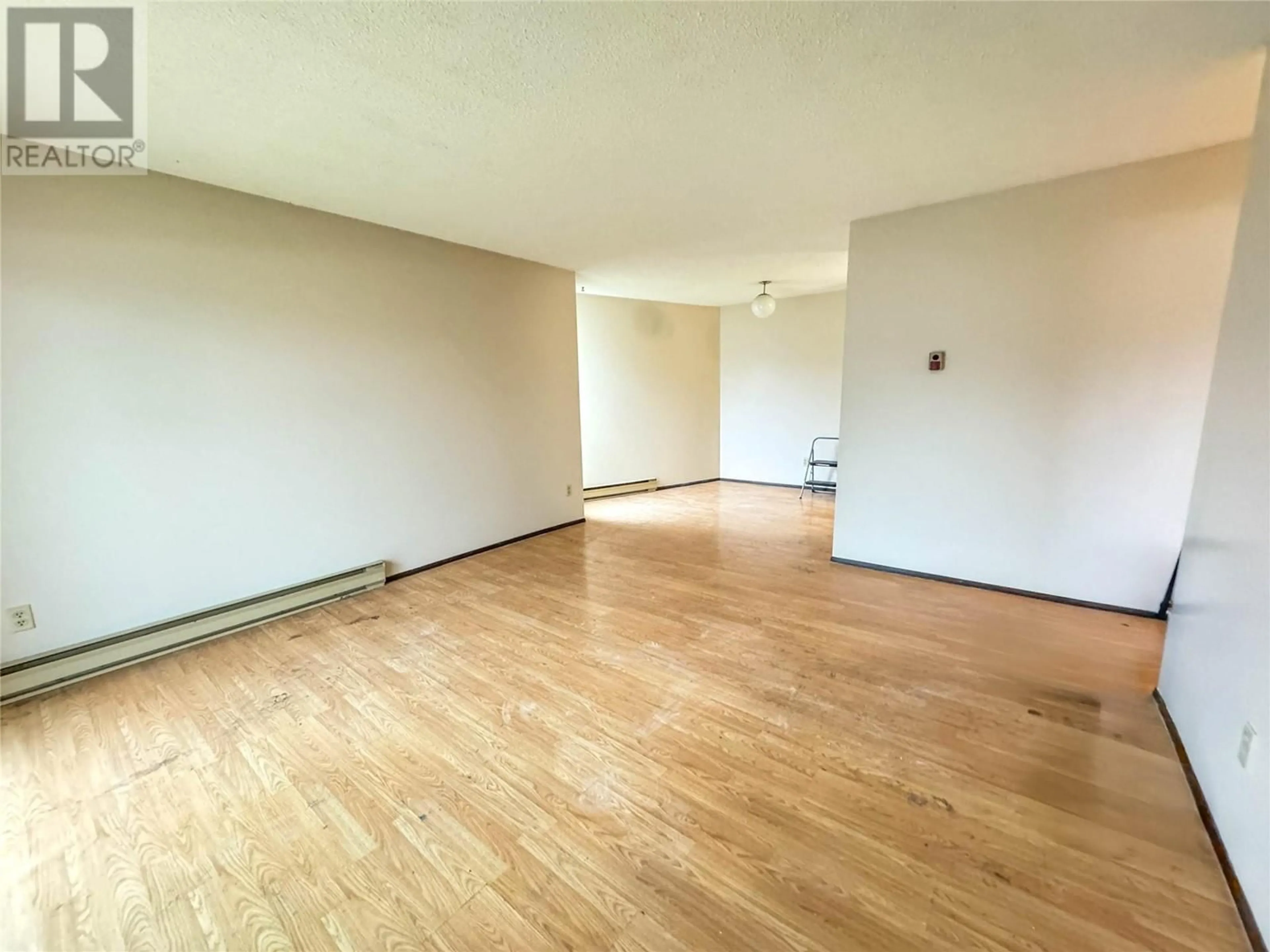 A pic of a room, wood floors for 1703 MENZIES Street Unit# 21 (205), Merritt British Columbia V1K1B8