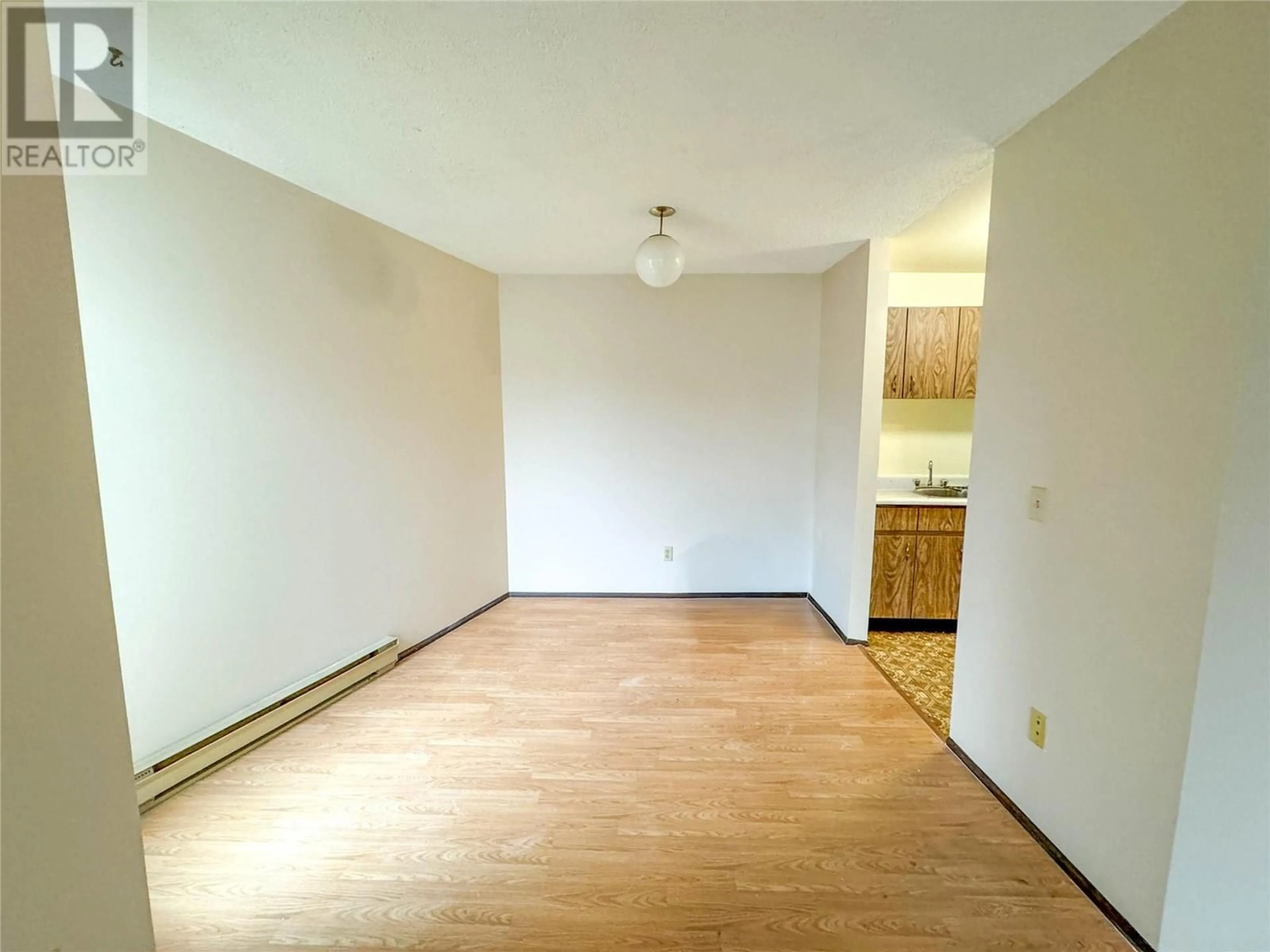 A pic of a room, wood floors for 1703 MENZIES Street Unit# 21 (205), Merritt British Columbia V1K1B8