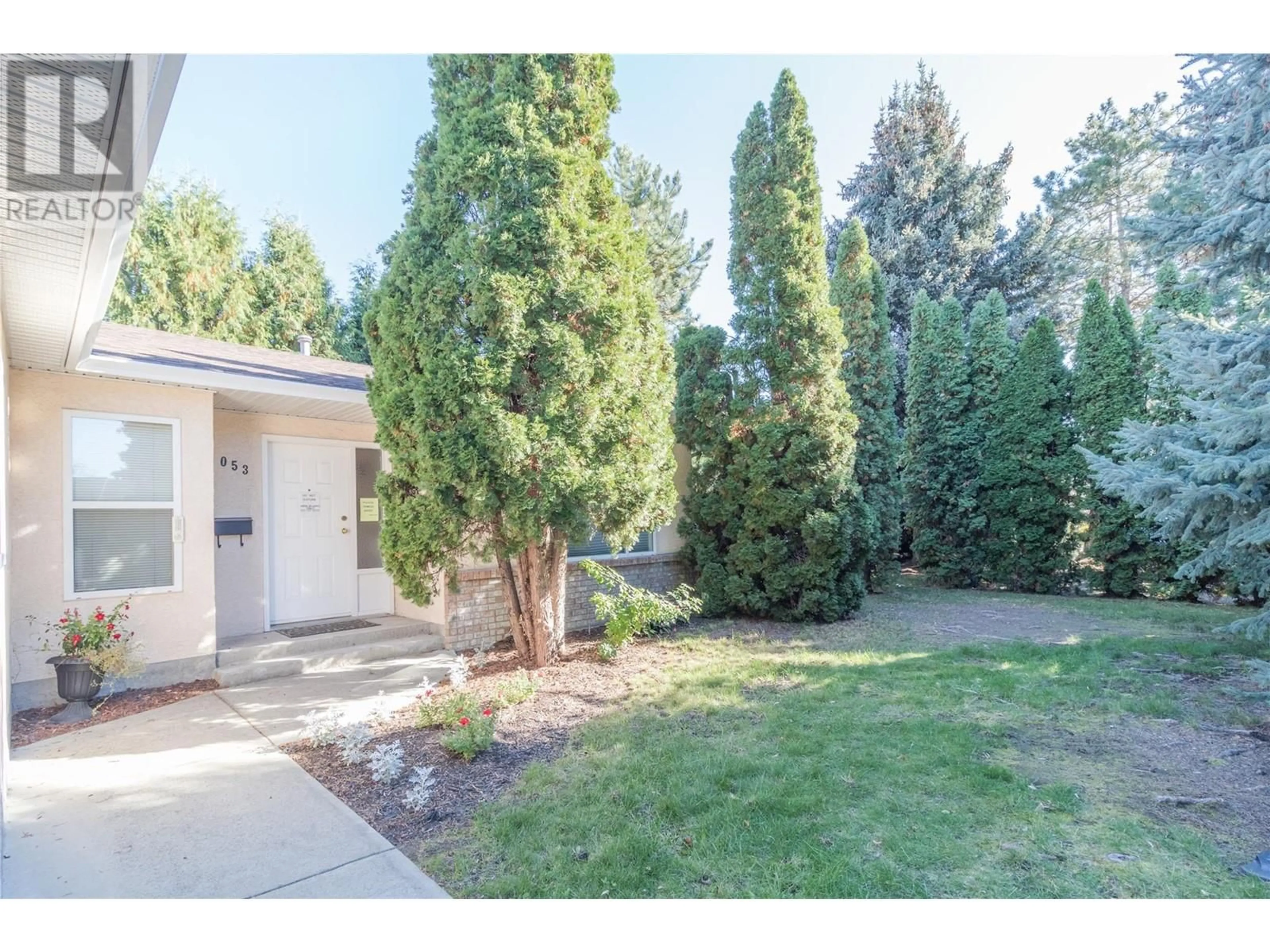 Frontside or backside of a home, the fenced backyard for 1053 Aldon Road, Kelowna British Columbia V1X6X8