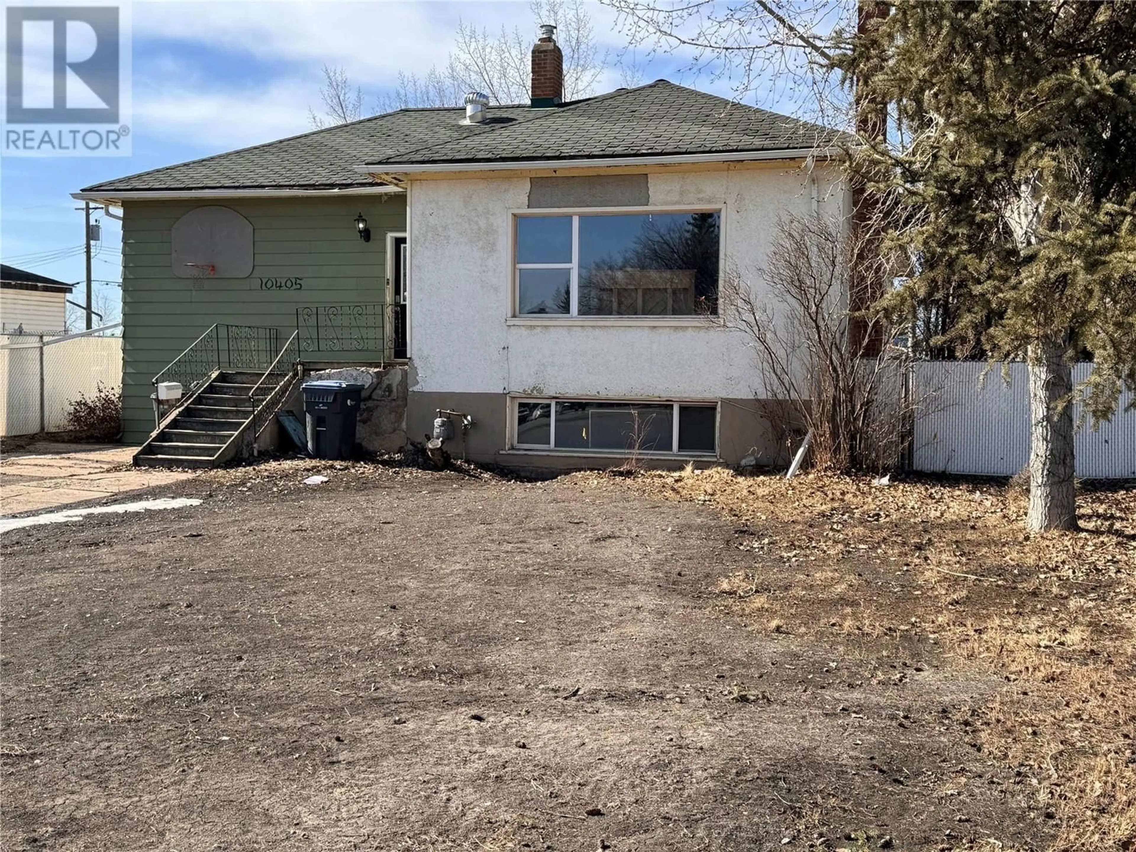 Frontside or backside of a home, the front or back of building for 10405 13 Street, Dawson Creek British Columbia V1G3W4