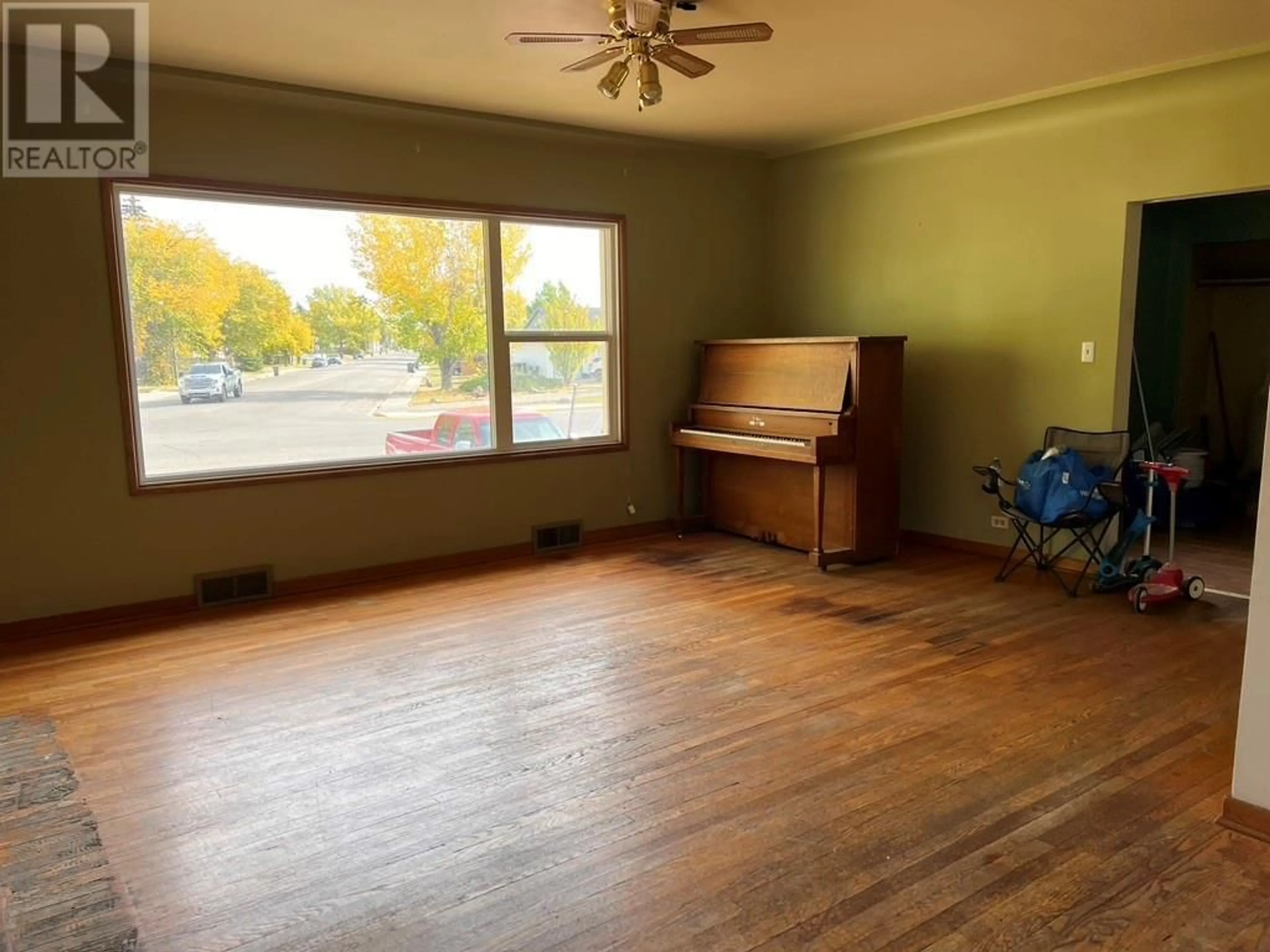 A pic of a room, wood floors for 10405 13 Street, Dawson Creek British Columbia V1G3W4