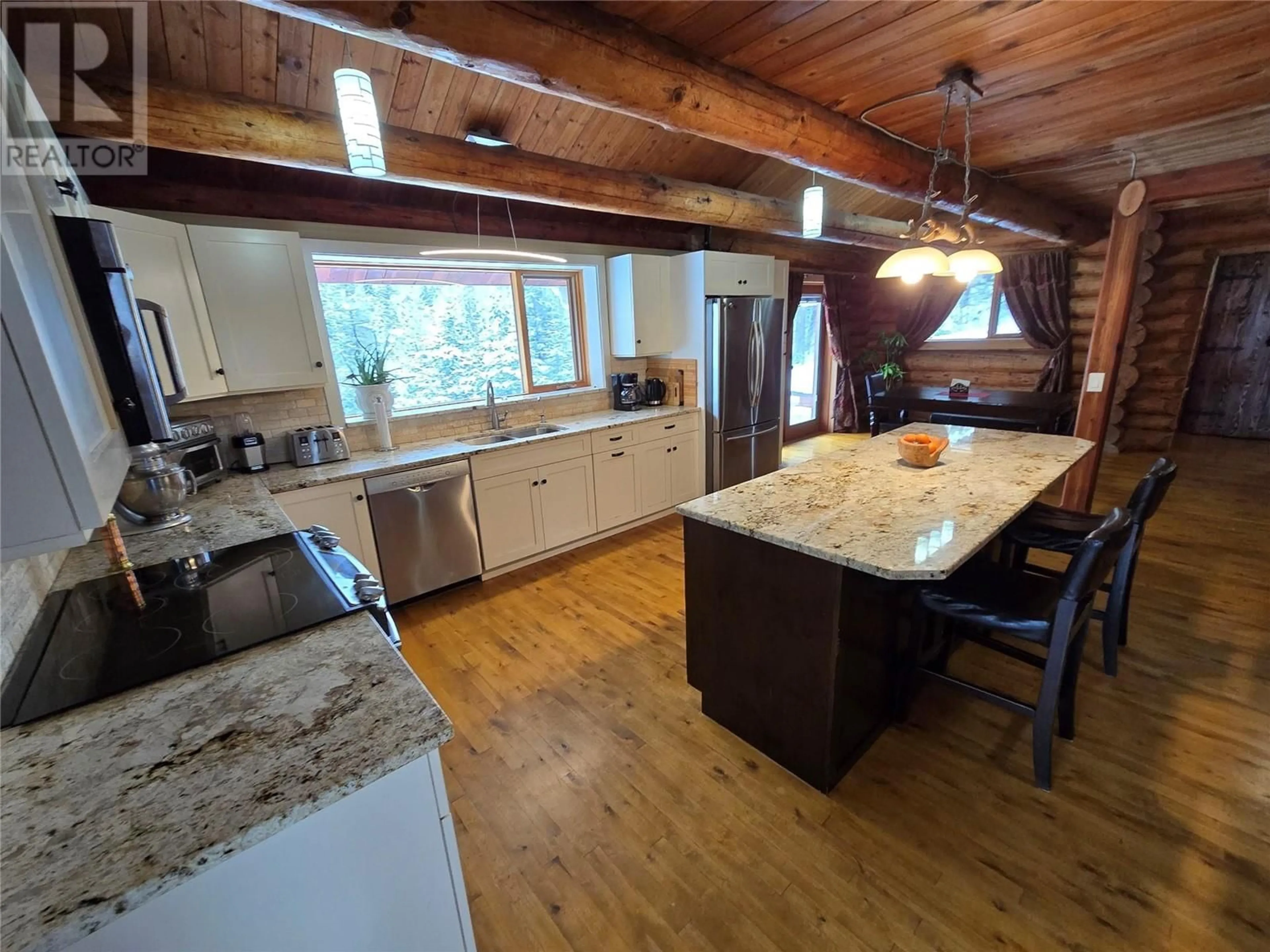 Open concept kitchen, wood/laminate floor for 2358 DUNN LAKE ROAD, Clearwater British Columbia V0E1N0