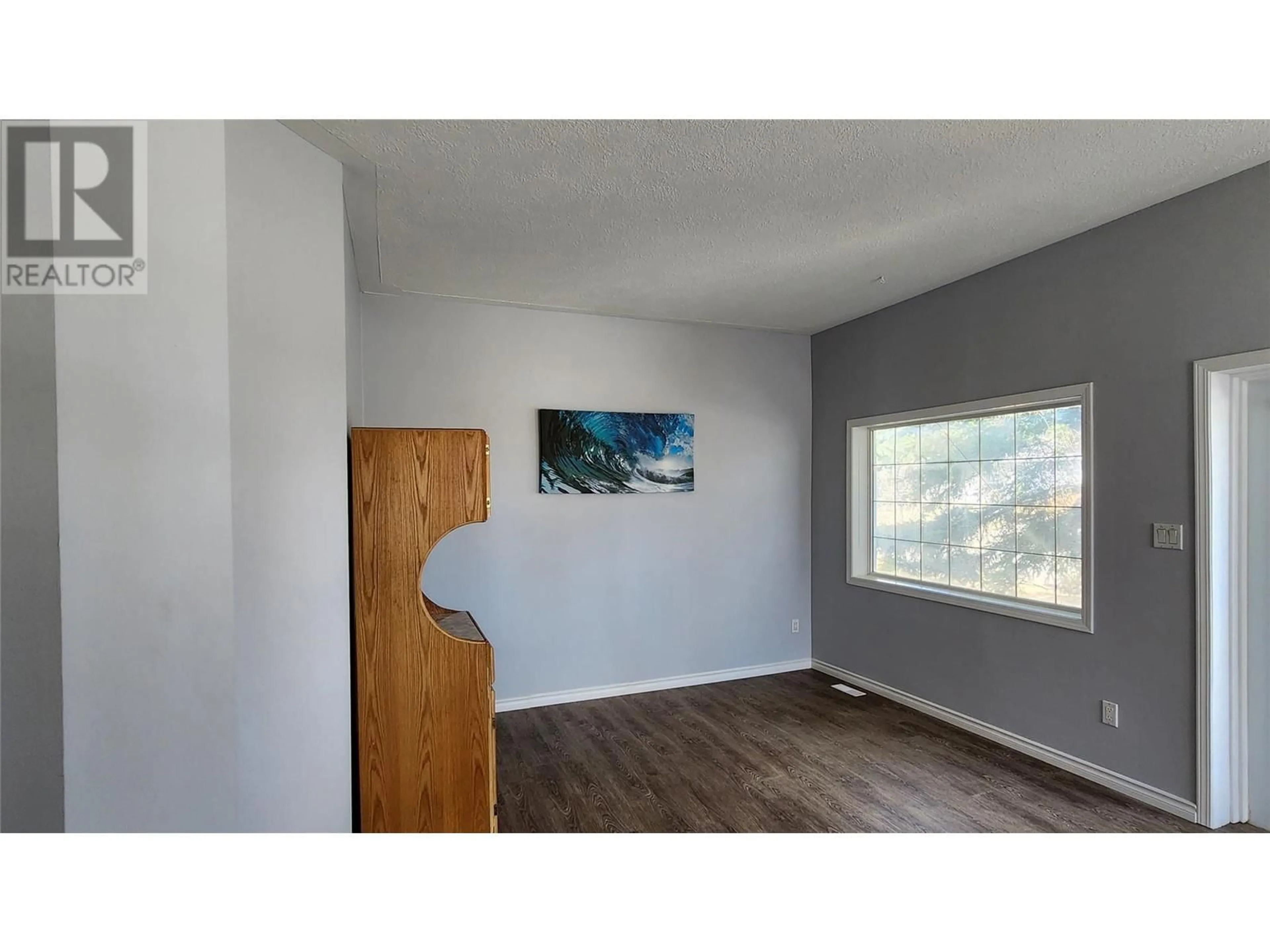 A pic of a room, wood floors for 1413 105 Avenue, Dawson Creek British Columbia V1G2M3