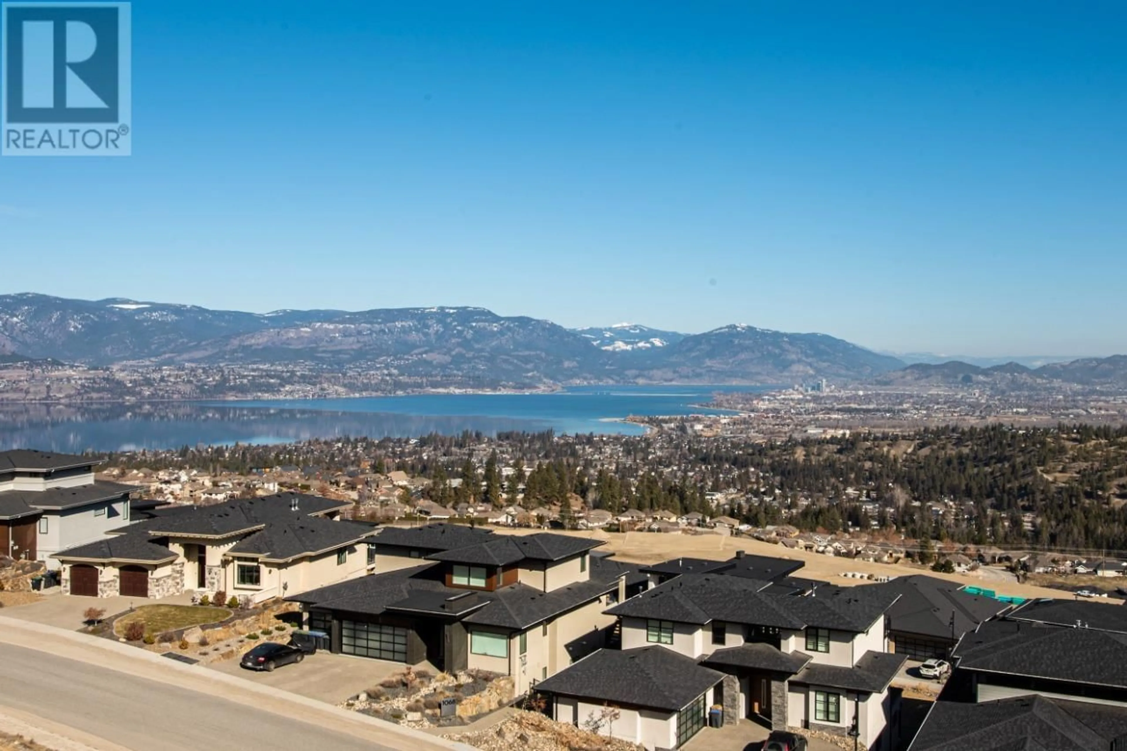 A pic from outside/outdoor area/front of a property/back of a property/a pic from drone, mountain view for 1018 EMSLIE STREET, Kelowna British Columbia V1W5J1