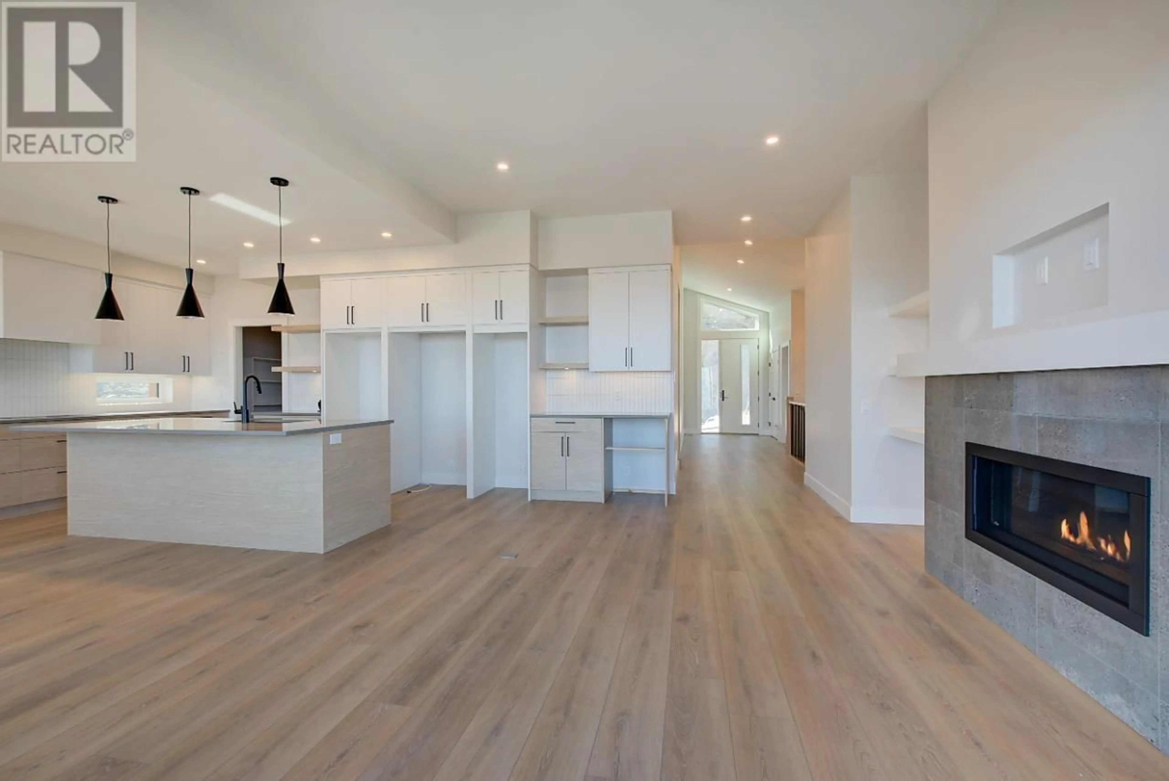 Open concept kitchen, wood/laminate floor for 1018 EMSLIE STREET, Kelowna British Columbia V1W5J1