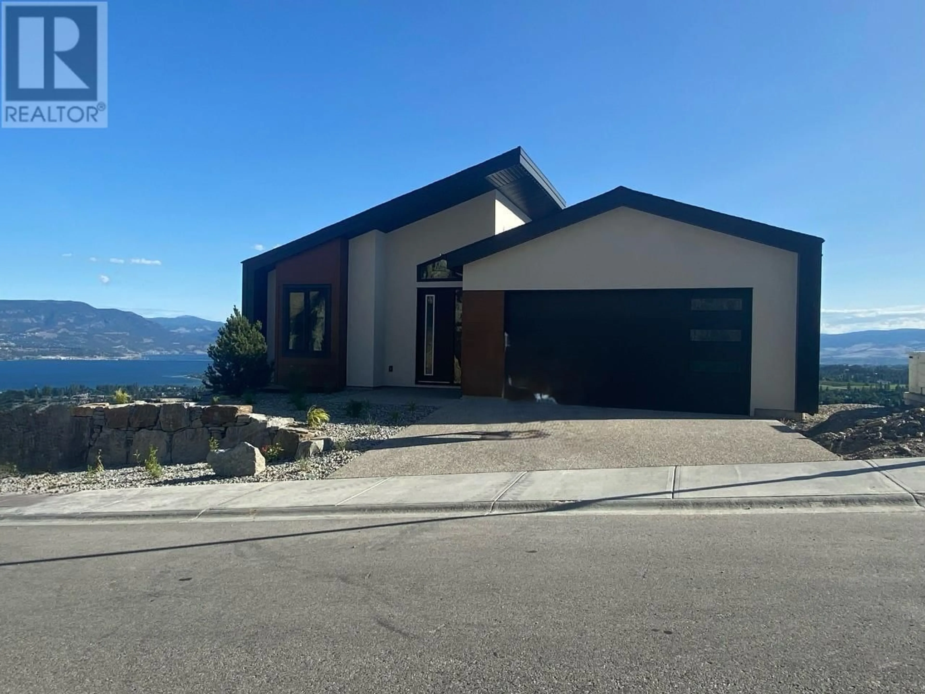 Frontside or backside of a home, the street view for 1018 Emslie Street, Kelowna British Columbia V1W5J1