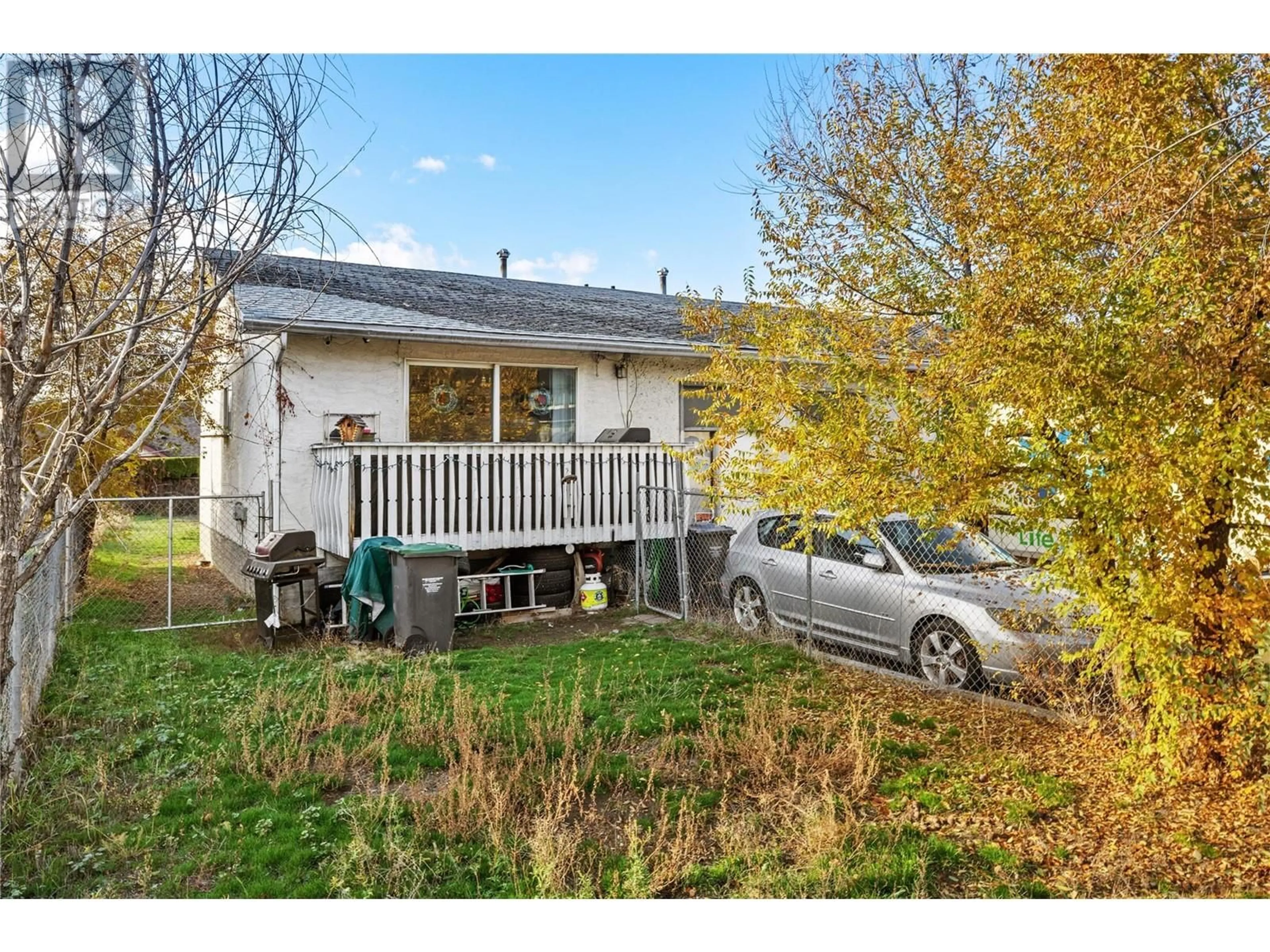 Frontside or backside of a home, the fenced backyard for 480 Hein Road, Kelowna British Columbia V1X4A3