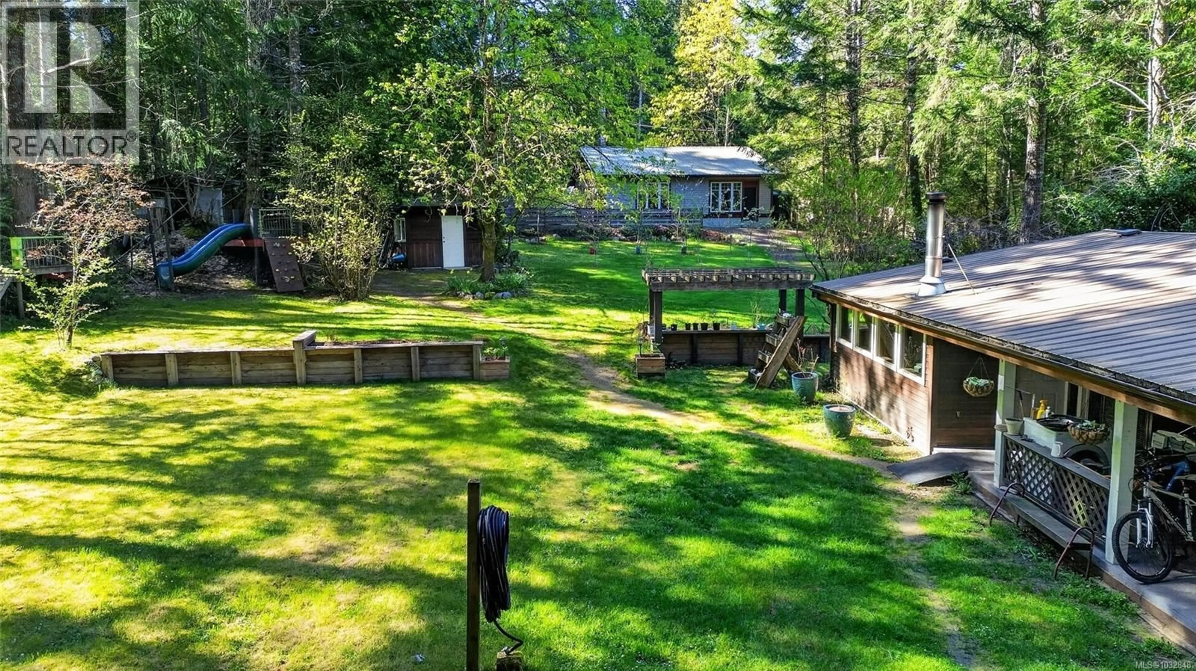 A pic from outside/outdoor area/front of a property/back of a property/a pic from drone, forest/trees view for 1208 NORTH ROAD, Gabriola Island British Columbia V0R1X3