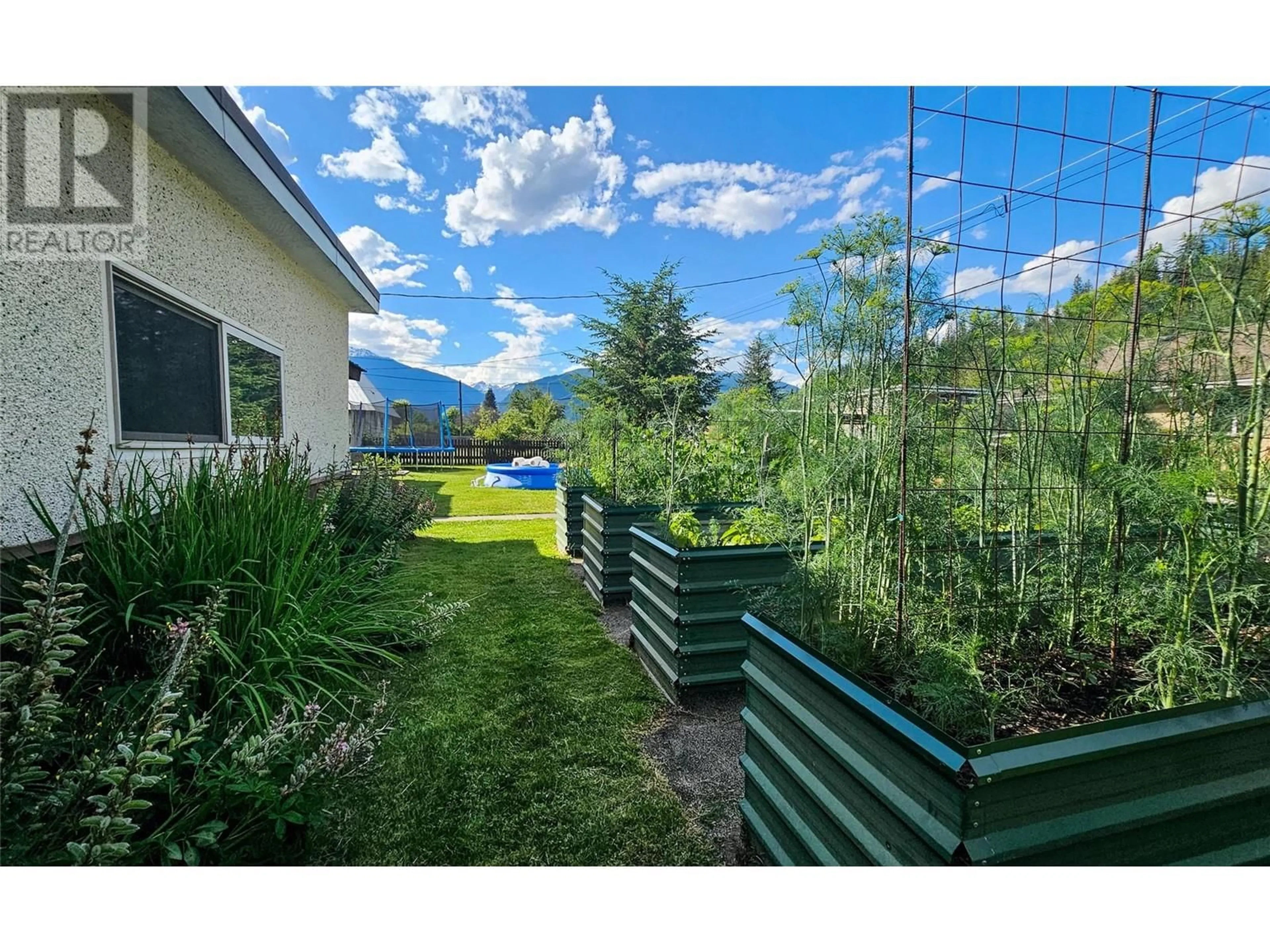 Patio, the fenced backyard for 1120 First Street W, Revelstoke British Columbia V0E2S0