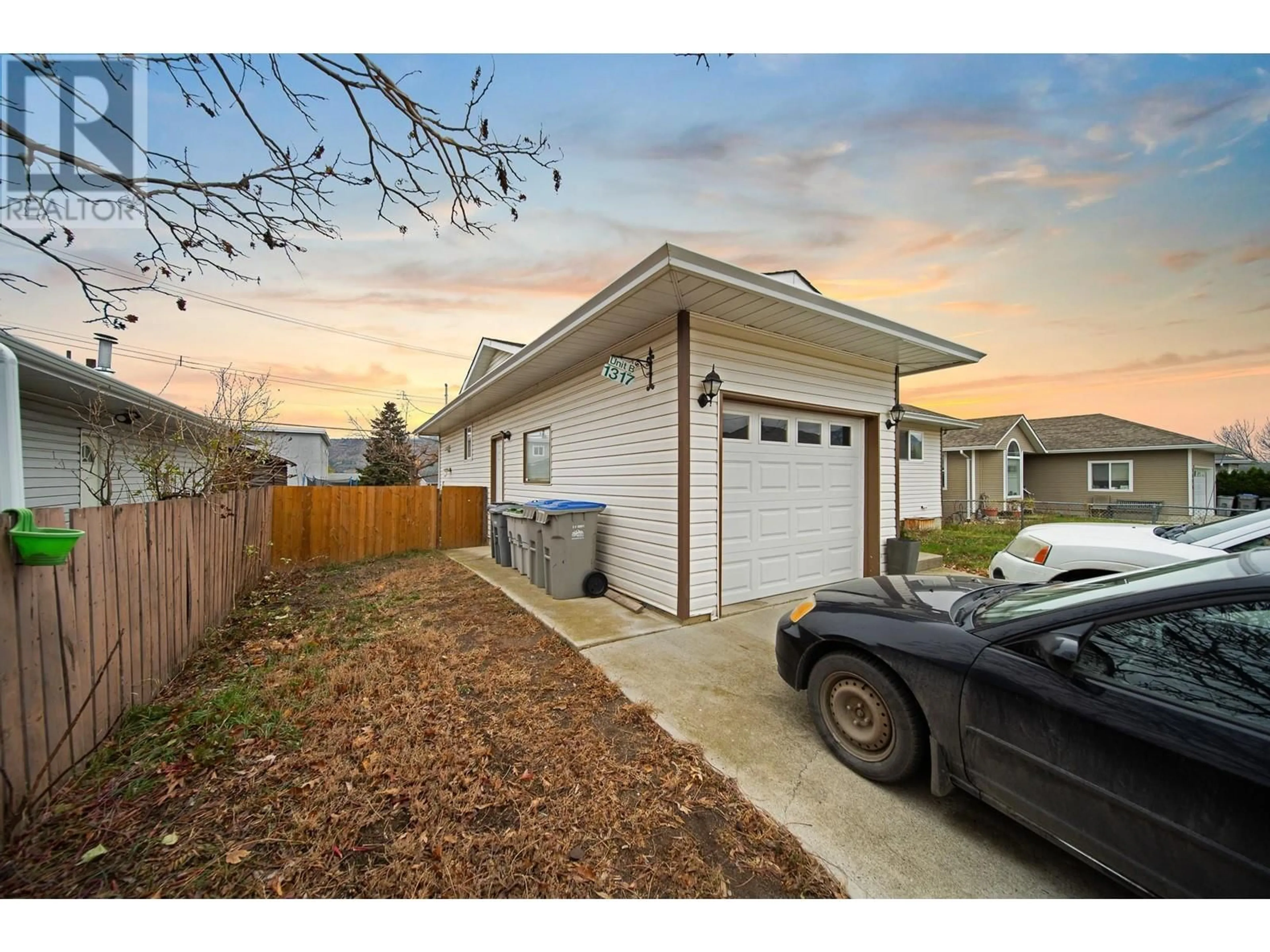 Frontside or backside of a home, the fenced backyard for 1317 Lethbridge Avenue Avenue, Kamloops British Columbia V2B8K6