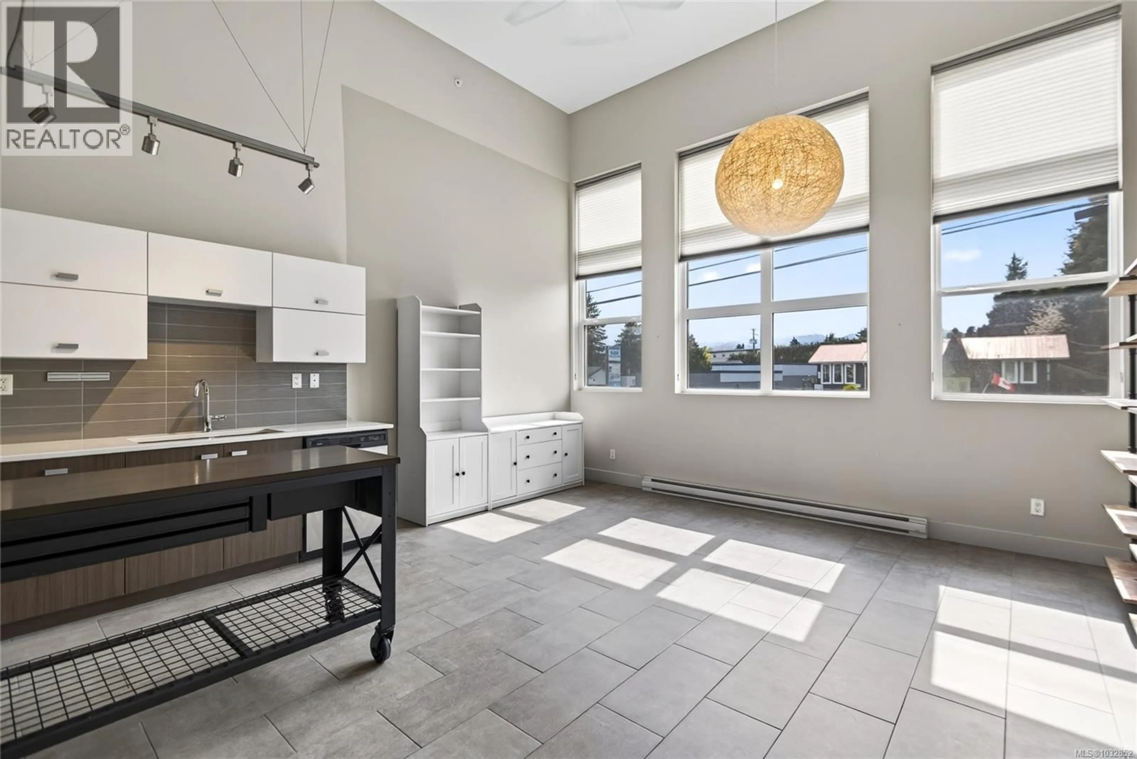 Open concept kitchen, ceramic/tile floor for 307 - 1978 CLIFFE AVENUE, Courtenay British Columbia V9N2N1