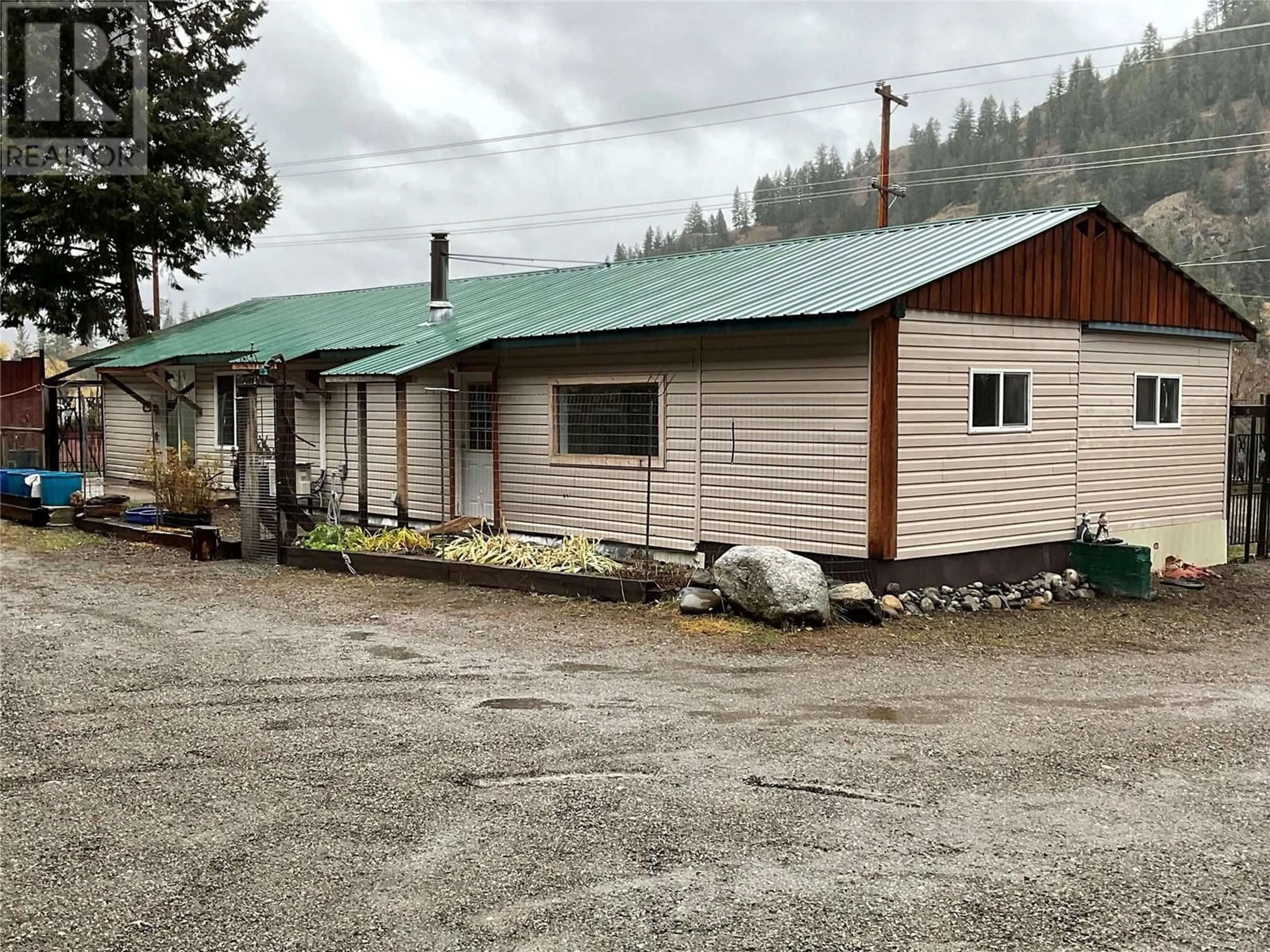 A pic from exterior of the house or condo, the front or back of building for 4098 3 Highway, Rock Creek British Columbia V0H1Y0