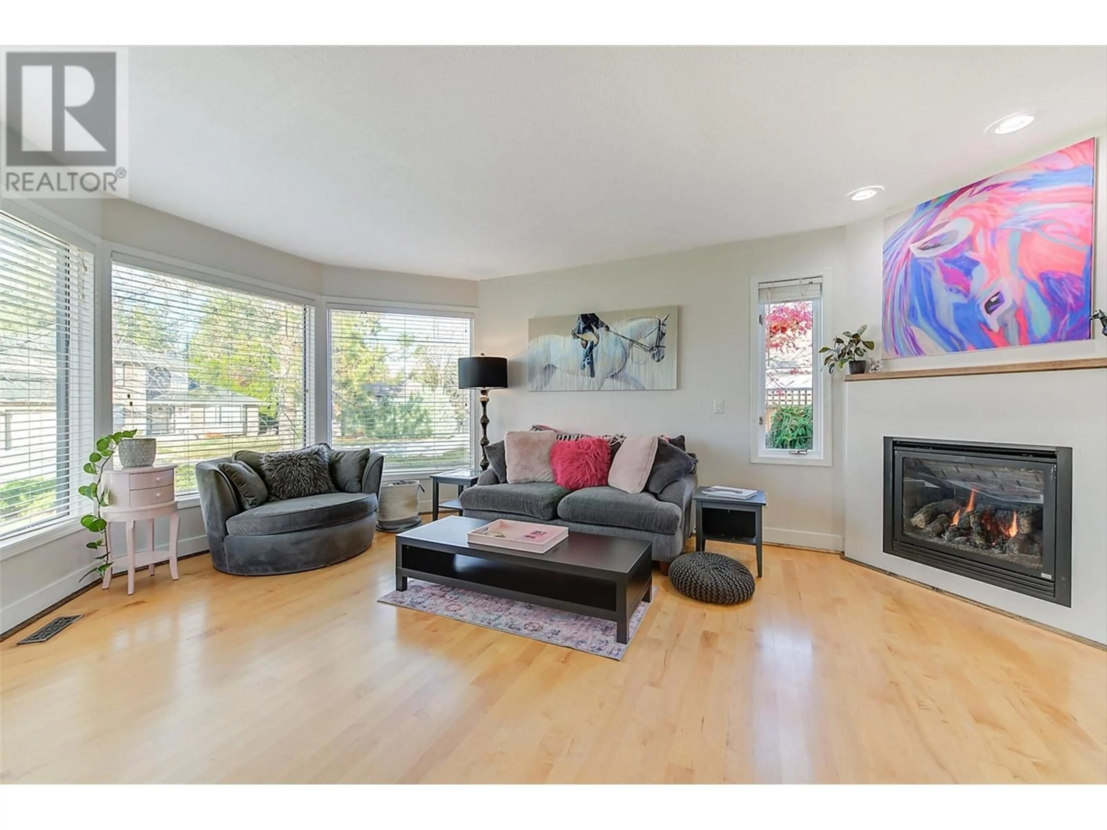 Living room, wood floors for 1523 Sunridge Court, Kelowna British Columbia V1W2Z9