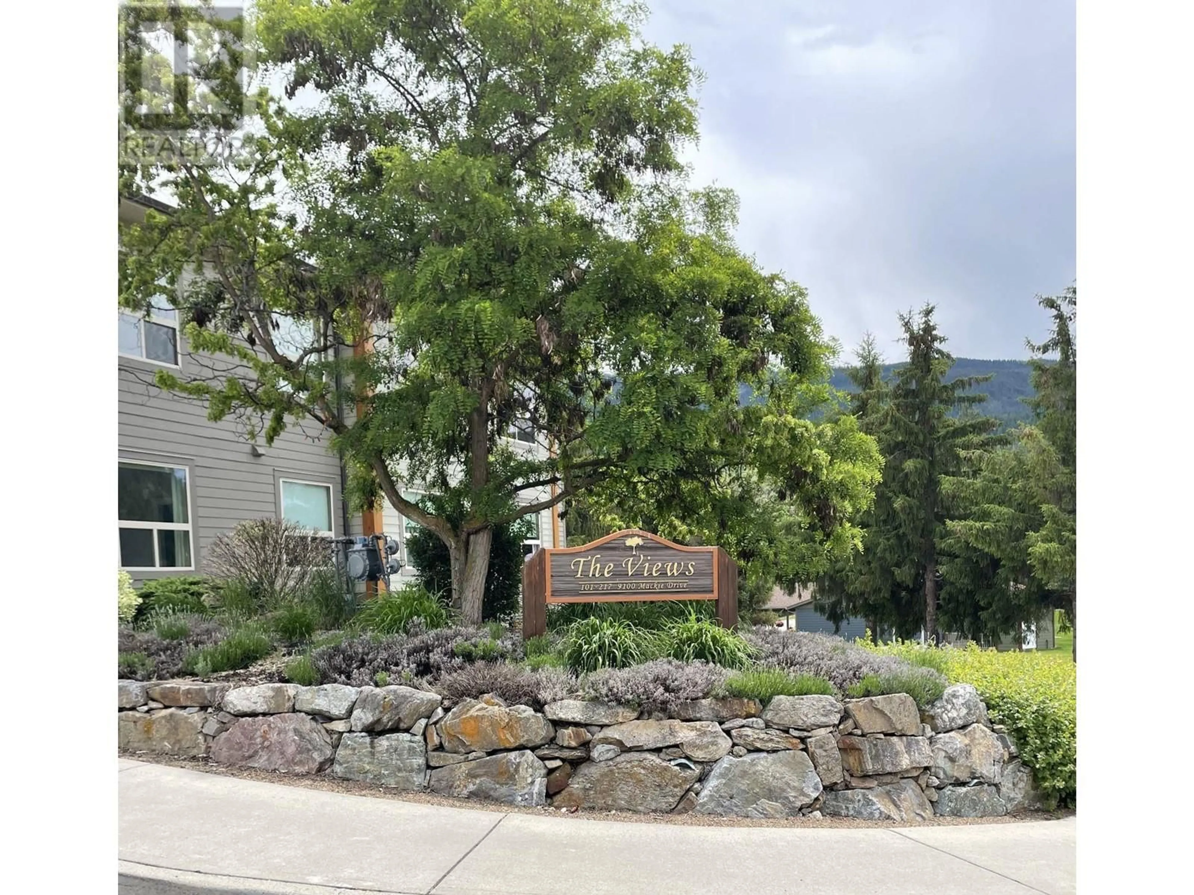 A pic from exterior of the house or condo, the street view for 9100 Mackie Drive Unit# 210, Coldstream British Columbia V1B1G9