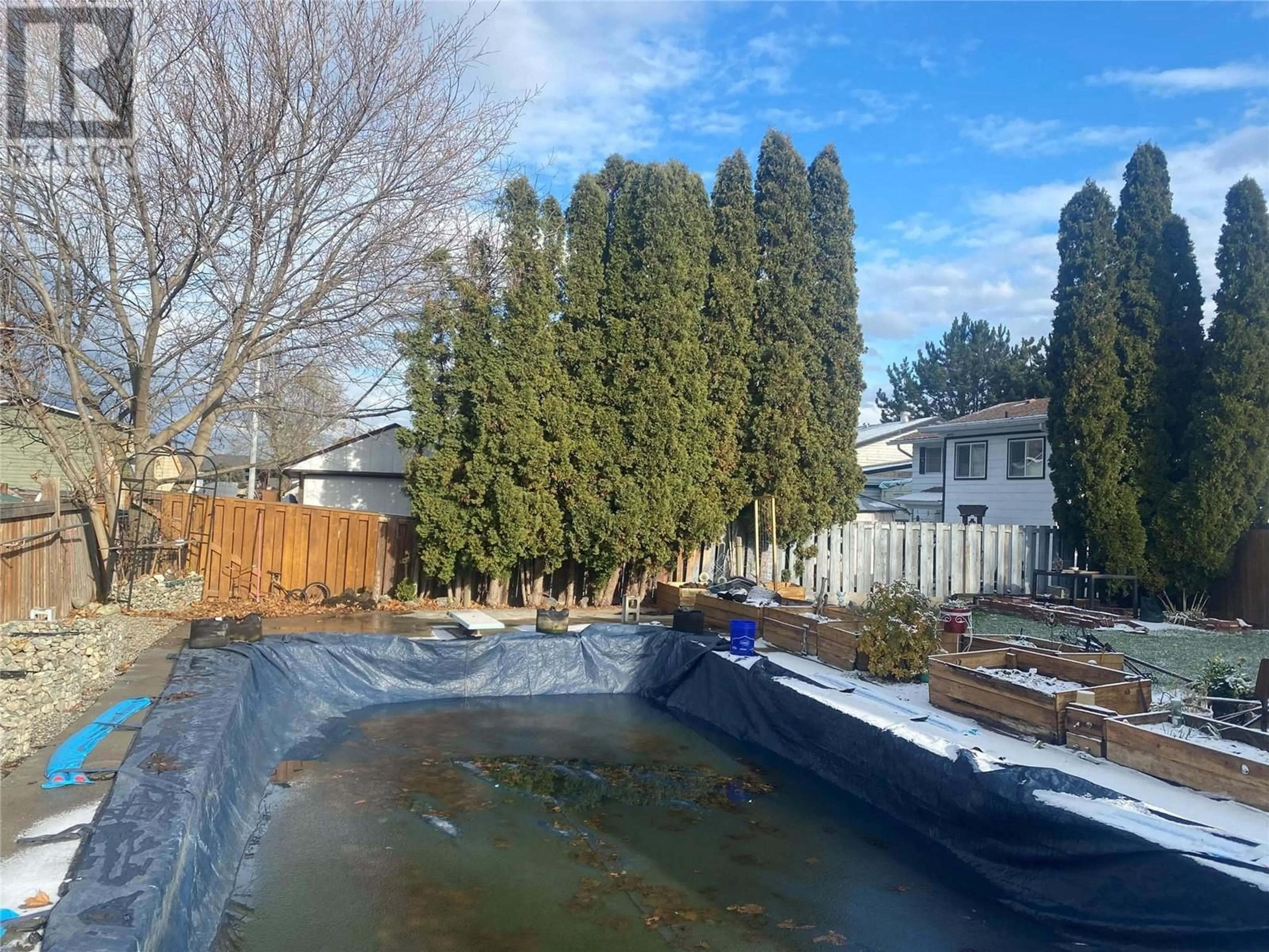 Frontside or backside of a home, the fenced backyard for 378 Reighmount Drive, Kamloops British Columbia V2H1M2