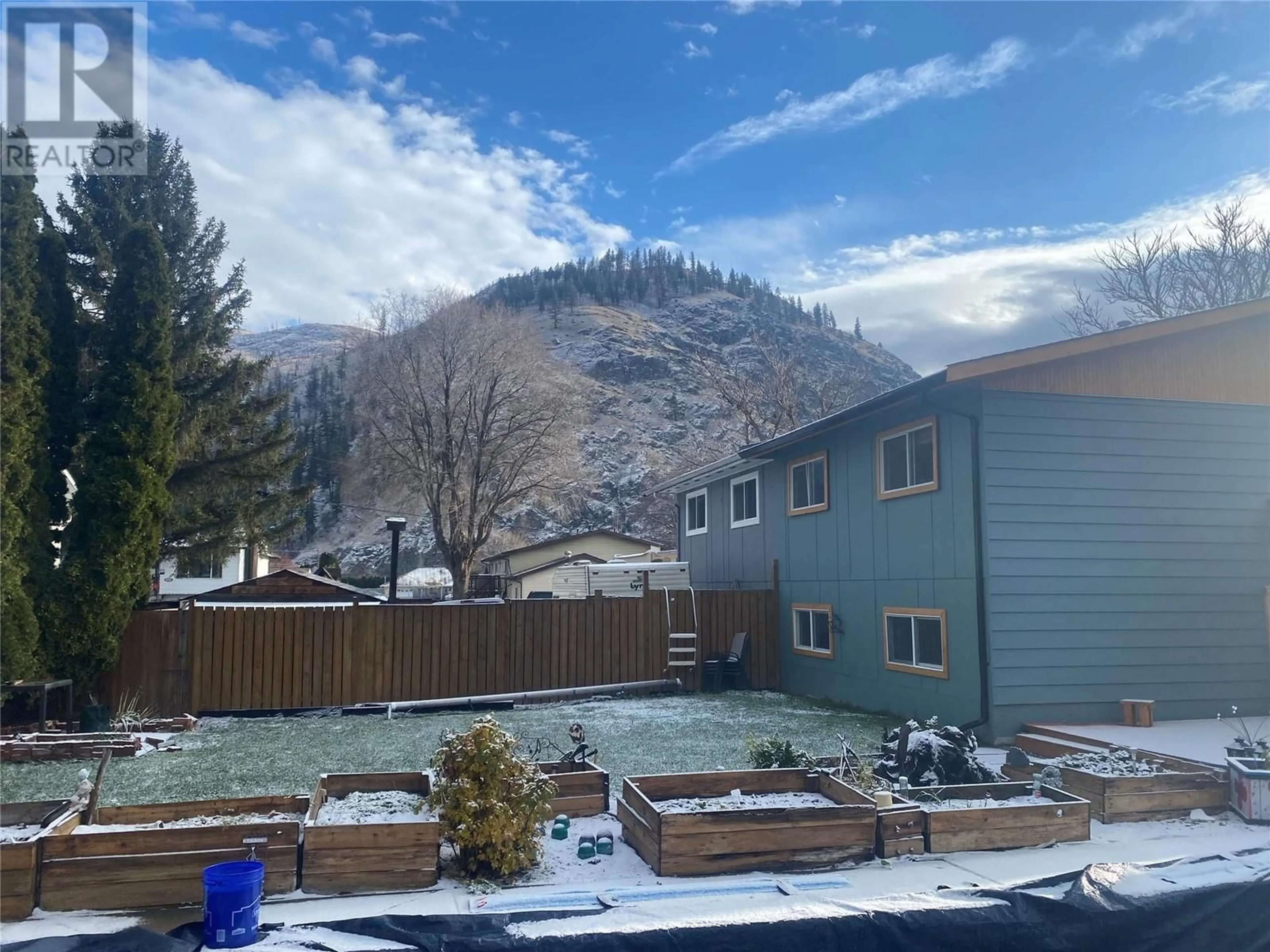 Frontside or backside of a home, the fenced backyard for 378 Reighmount Drive, Kamloops British Columbia V2H1M2