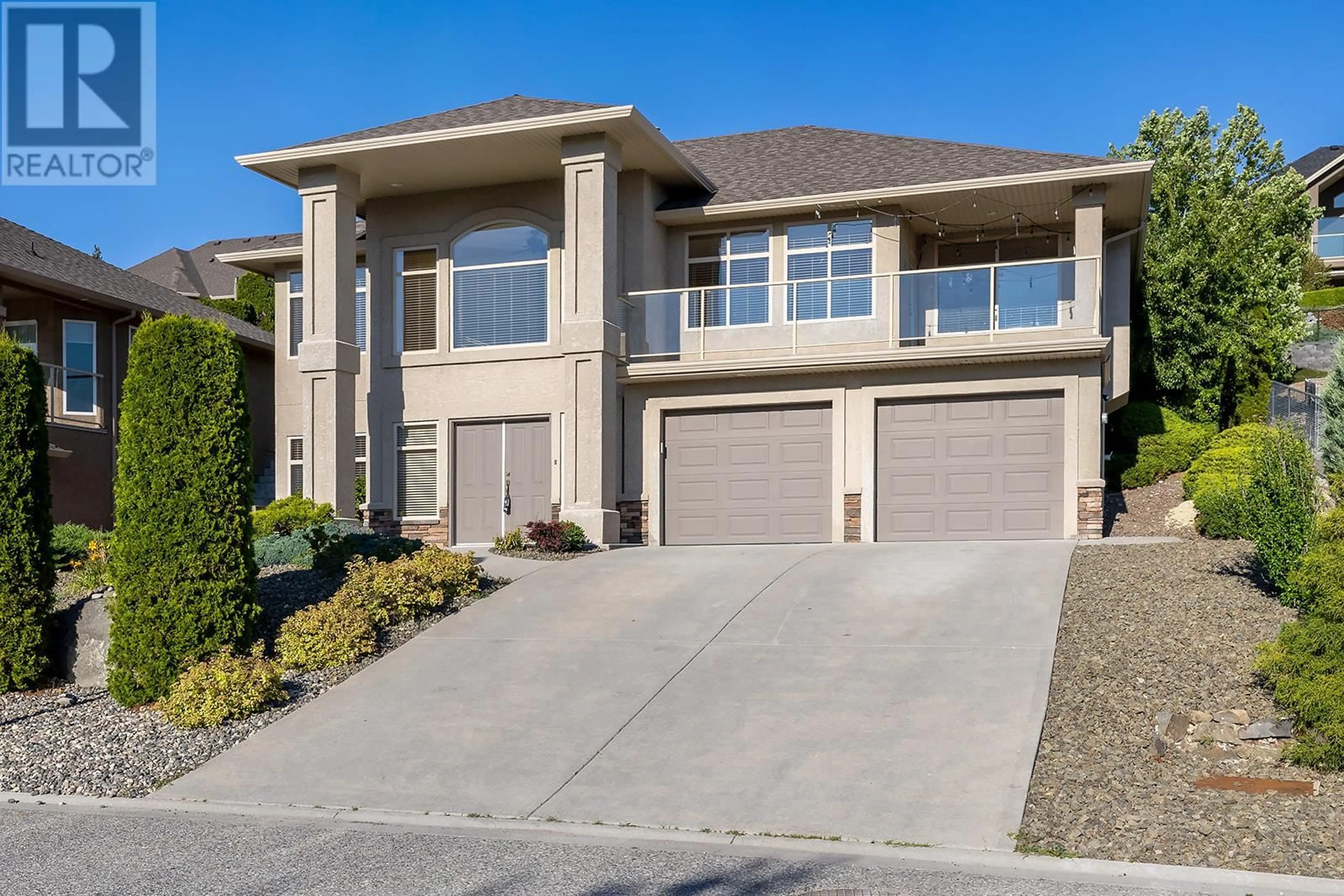 Frontside or backside of a home, the street view for 1592 Merlot Drive, West Kelowna British Columbia V4T2X7