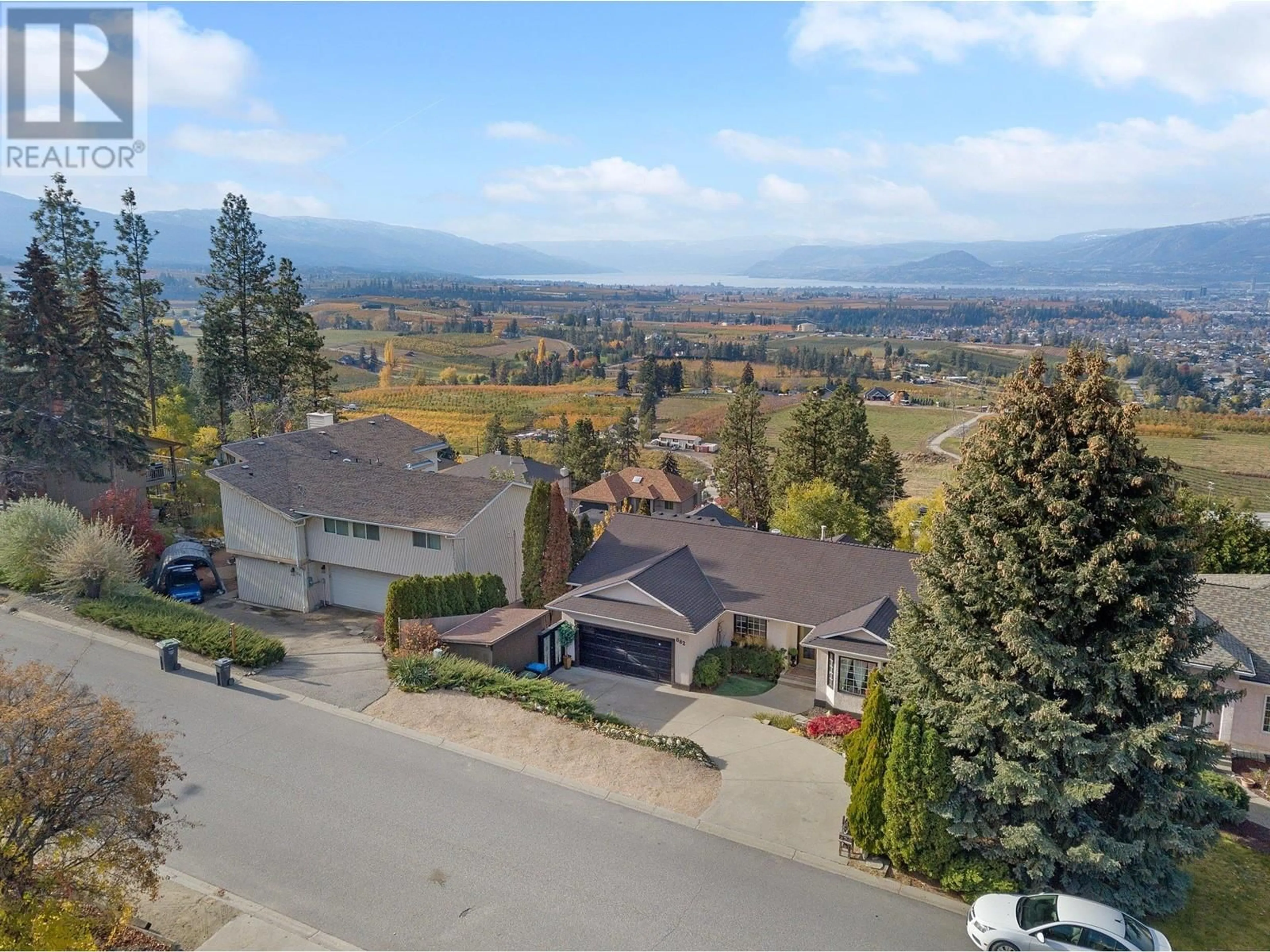 Frontside or backside of a home, the street view for 882 Toovey Road, Kelowna British Columbia V1X6R1