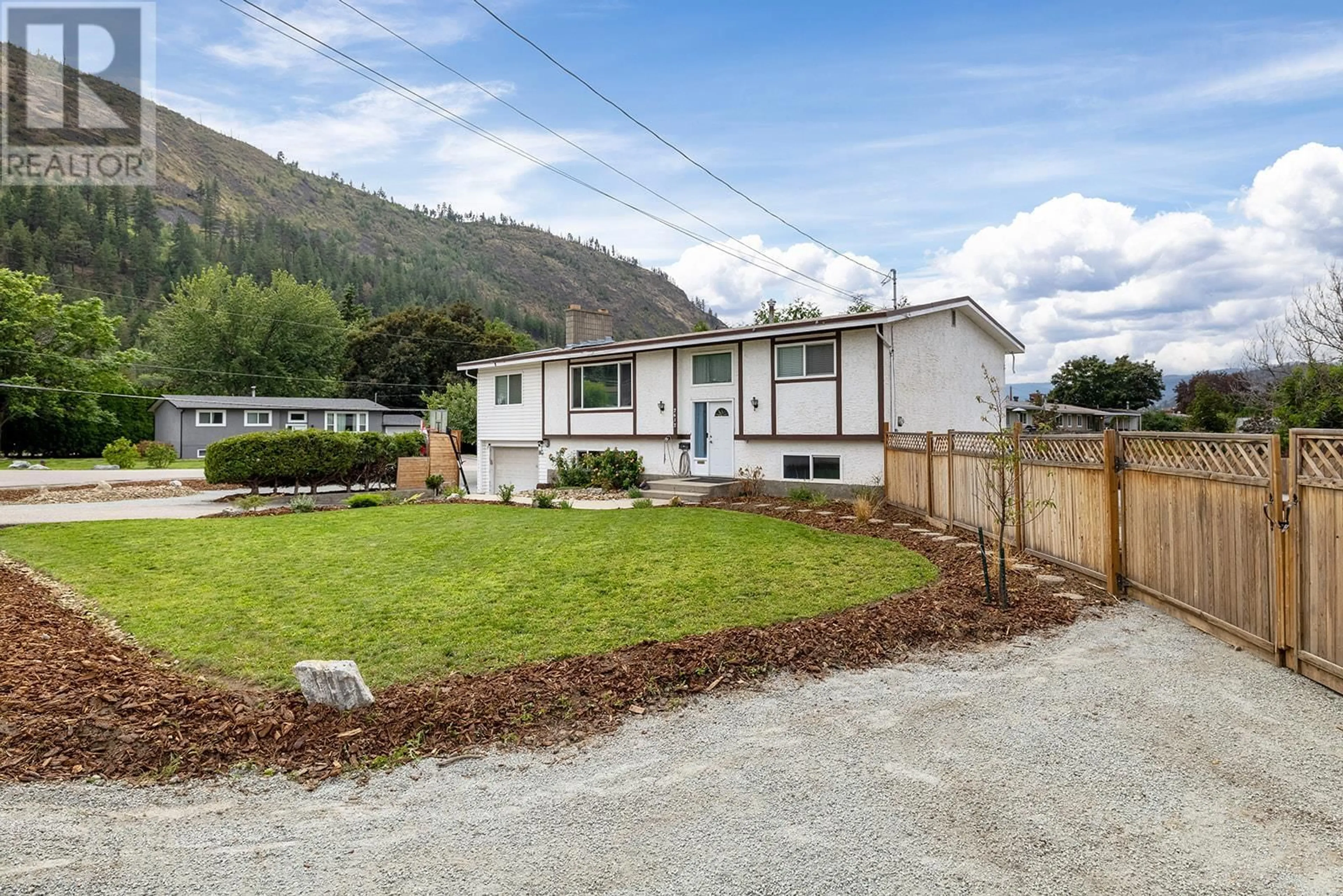 Frontside or backside of a home, the fenced backyard for 2612 Applewood Road, West Kelowna British Columbia V1Z2L8