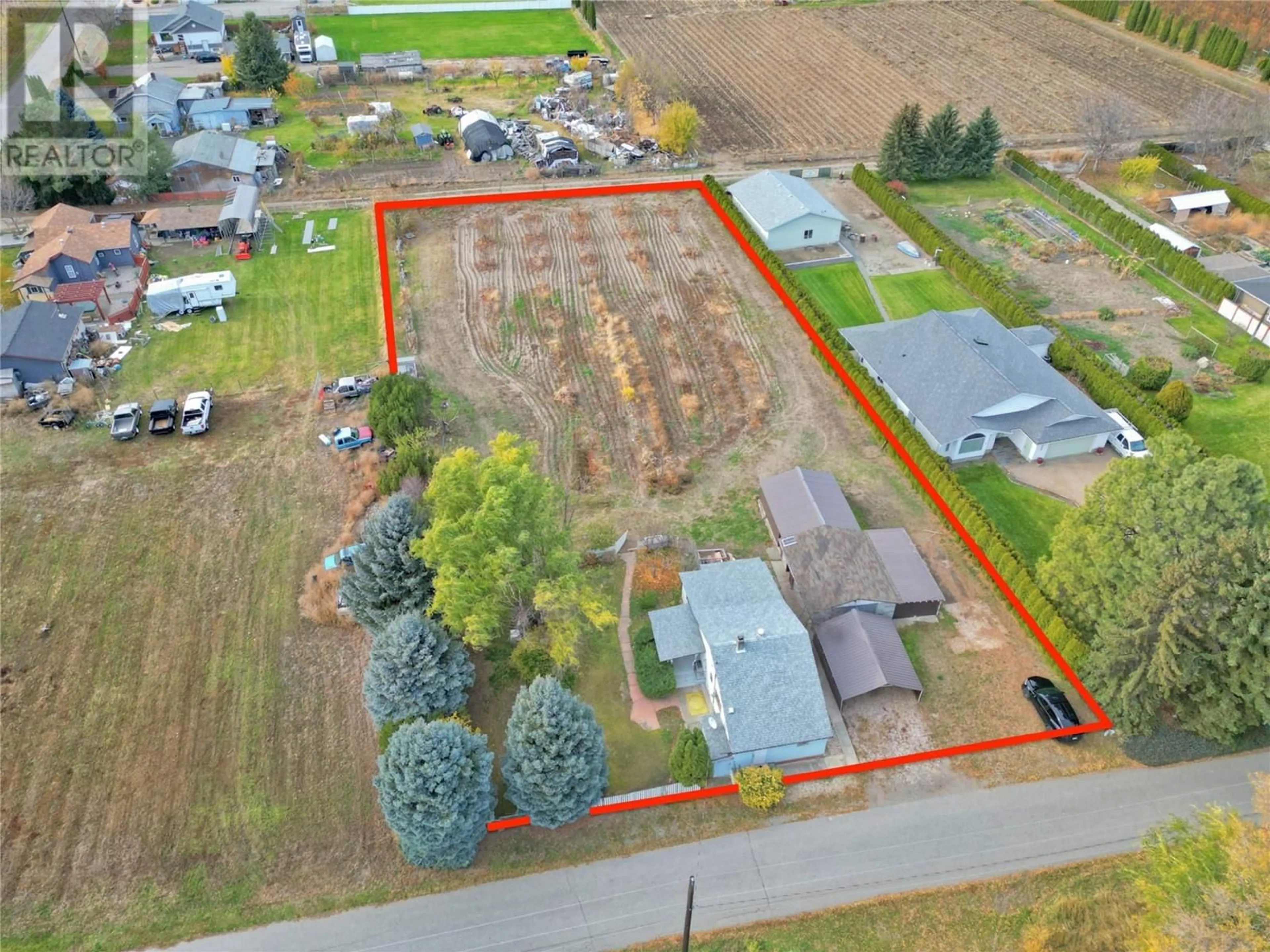 Frontside or backside of a home, the fenced backyard for 5218 Haynes Road, Oliver British Columbia V0H1T1