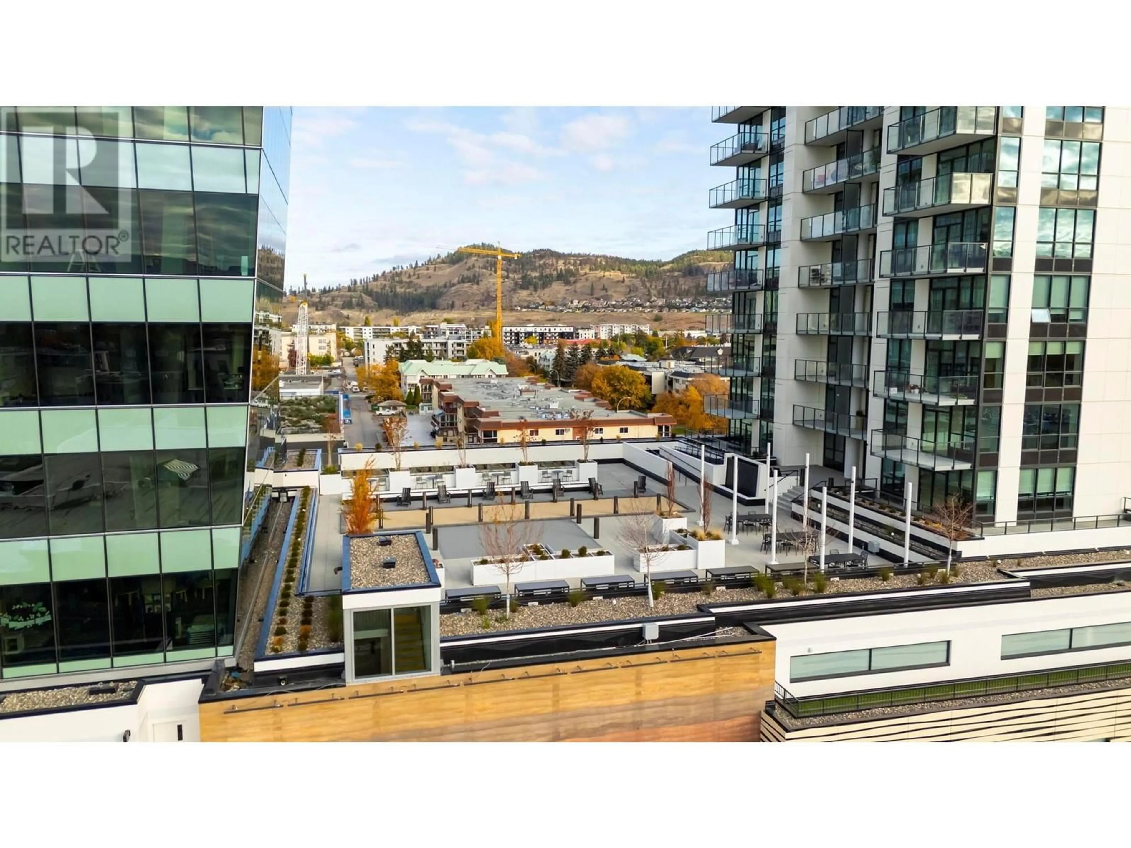 A pic from exterior of the house or condo, the view of city buildings for 1488 Bertram Street Unit# 706, Kelowna British Columbia V1Y0M6