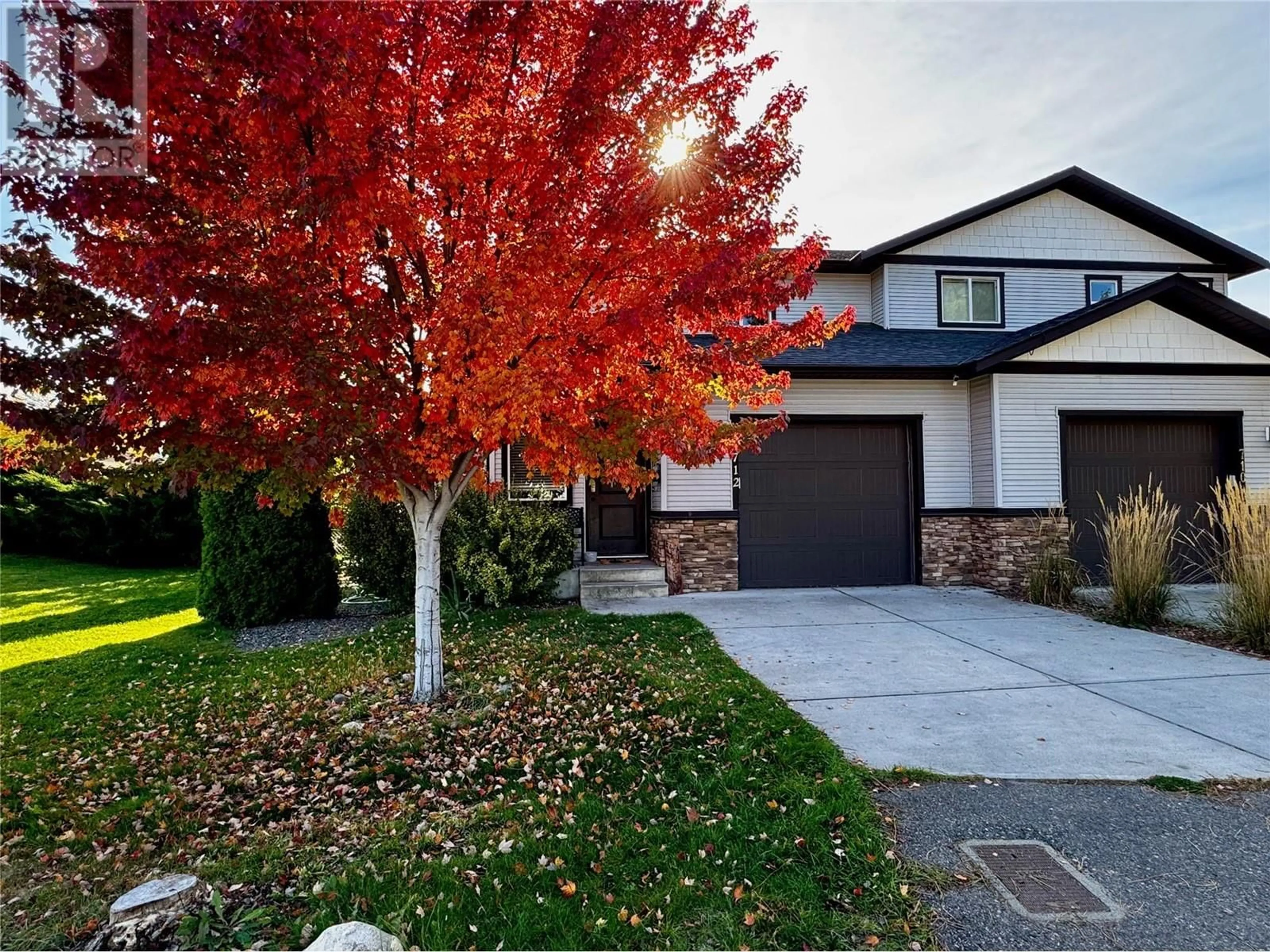 Frontside or backside of a home, the street view for 712 Ruston Road, Kelowna British Columbia V1X3Y2