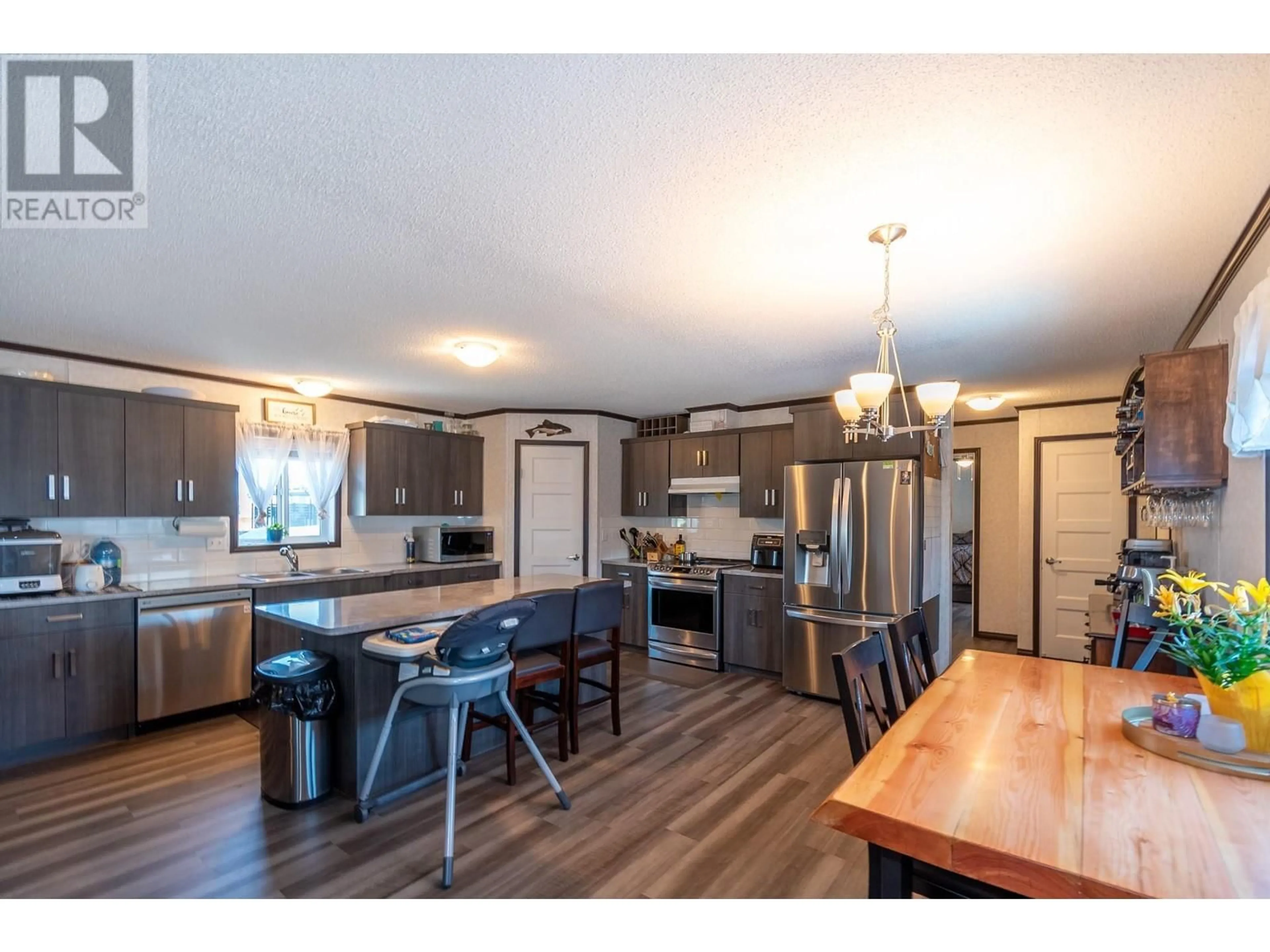 Open concept kitchen for 63 Antoine Road Unit# 123, Vernon British Columbia V1H2A3