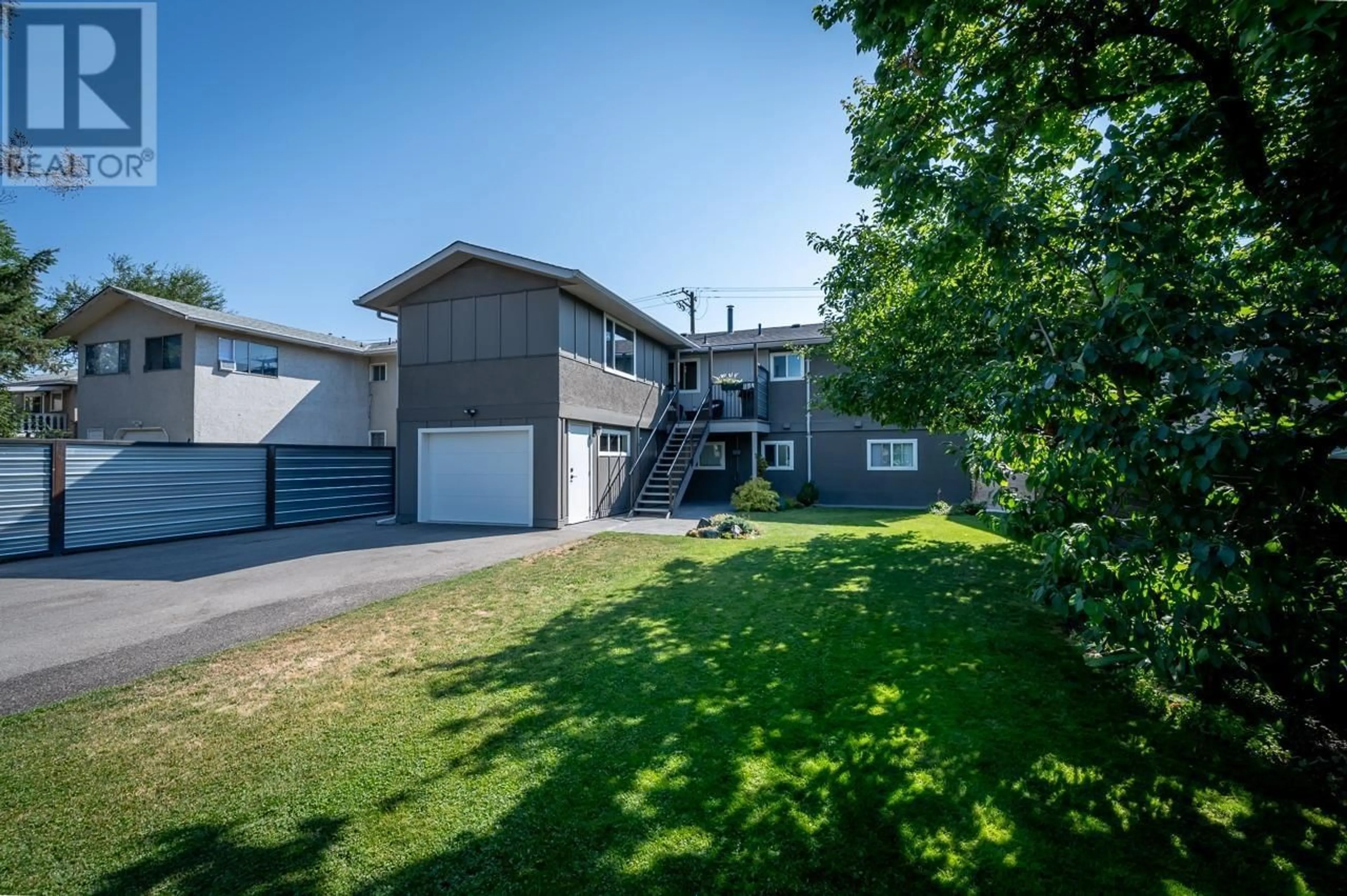 A pic from exterior of the house or condo, the fenced backyard for 991 12th Street, Kamloops British Columbia V2B3C3