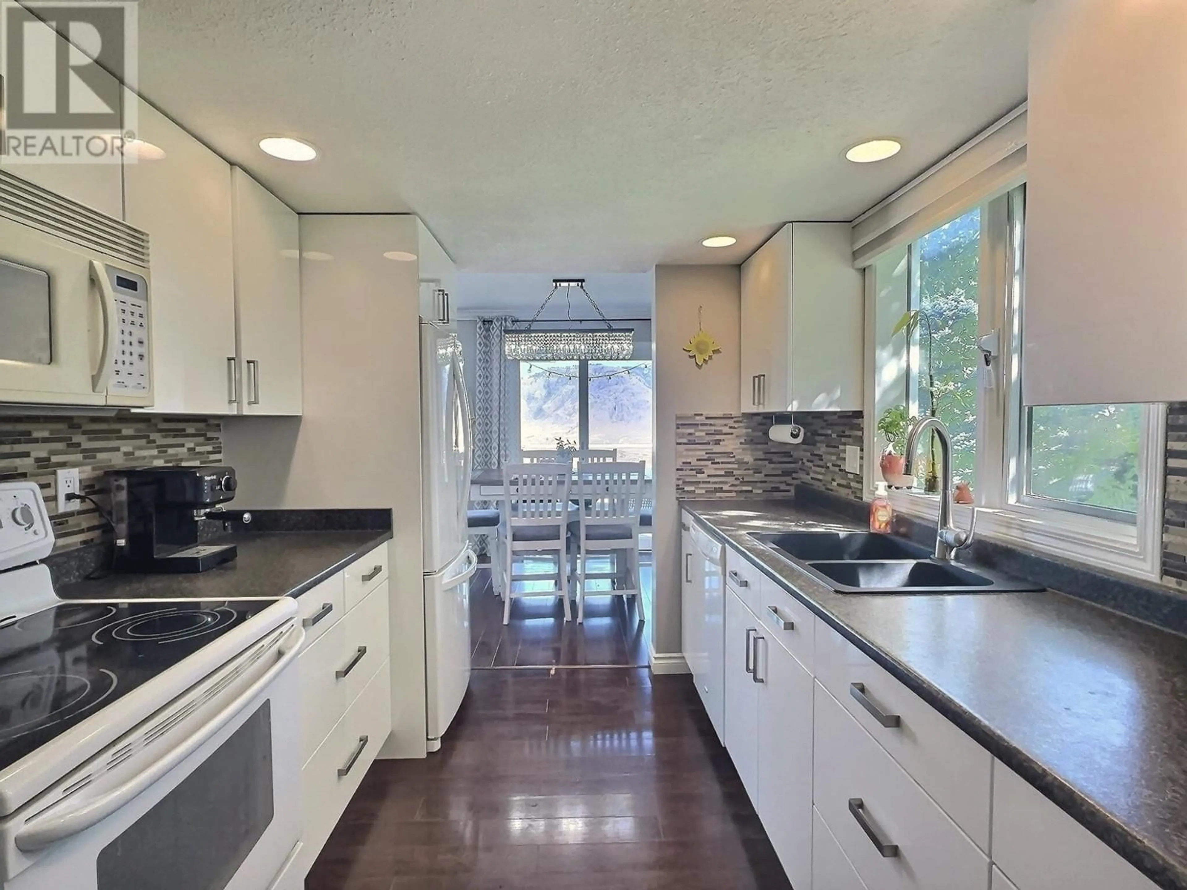 Contemporary kitchen, wood floors for 2526 NECHAKO Drive Unit# 1, Kamloops British Columbia V2E2C9