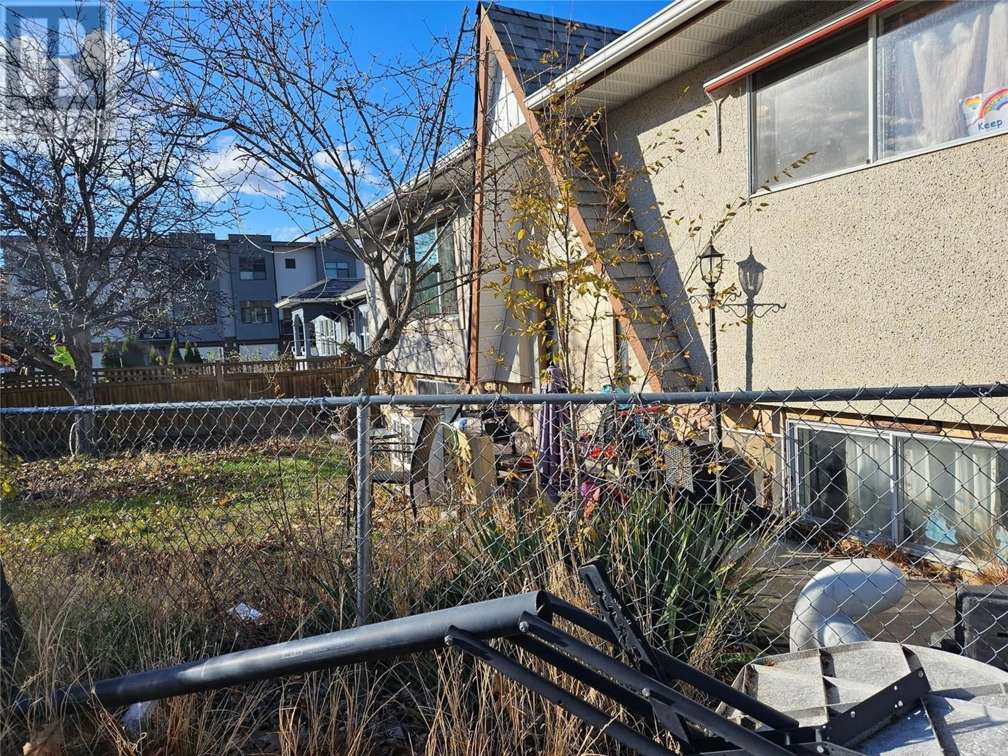 A pic from exterior of the house or condo, the fenced backyard for 425 Gahan Avenue, Penticton British Columbia V2A2C6