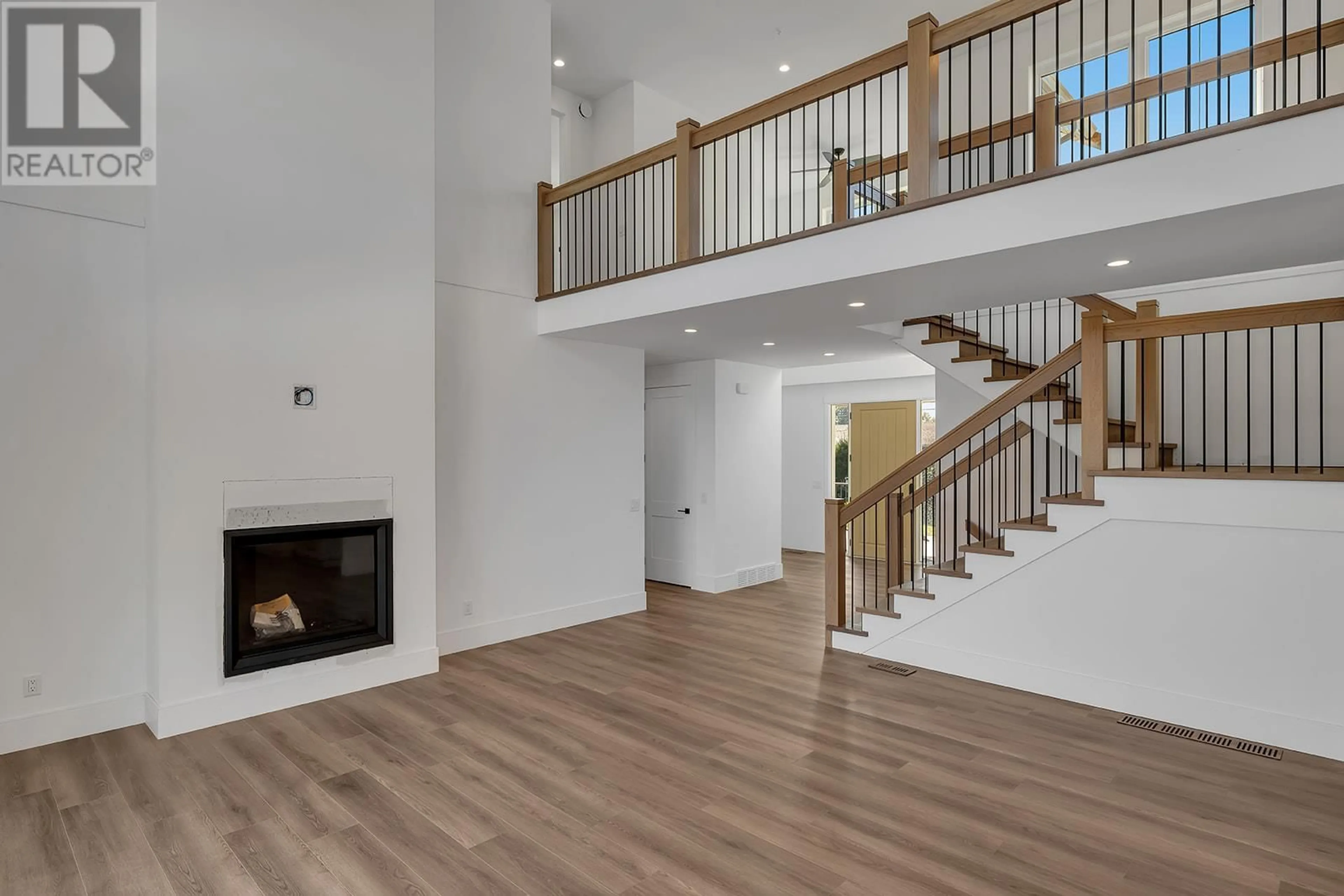 Indoor foyer, wood floors for 2070 Fisher Road, Kelowna British Columbia V1W2H2